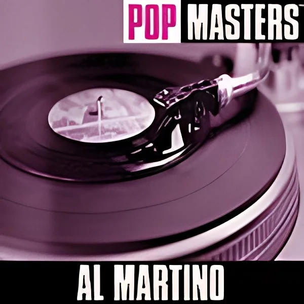 Close-up of a vinyl record player spinning a record, with the text 'POP MASTERS' and 'AL MARTINO' on the cover or promotional material.