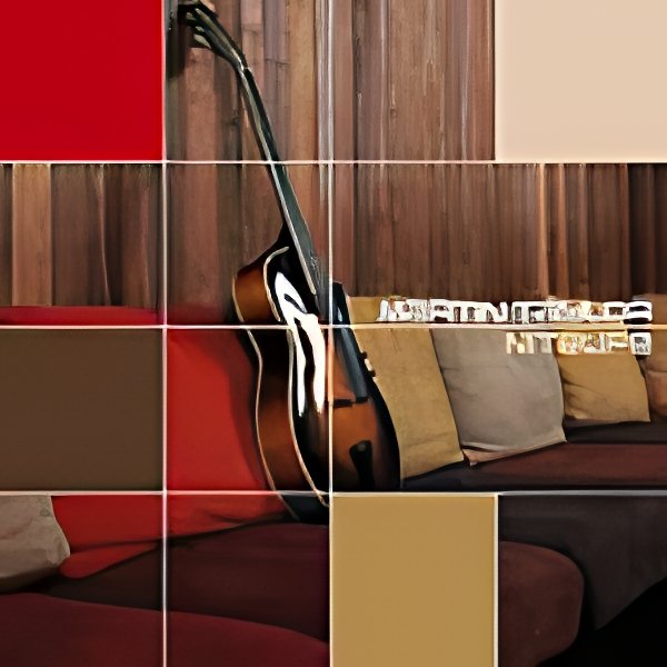 A wall with a wooden panel background, red and beige furniture, a guitar, and decorative items on a sofa.