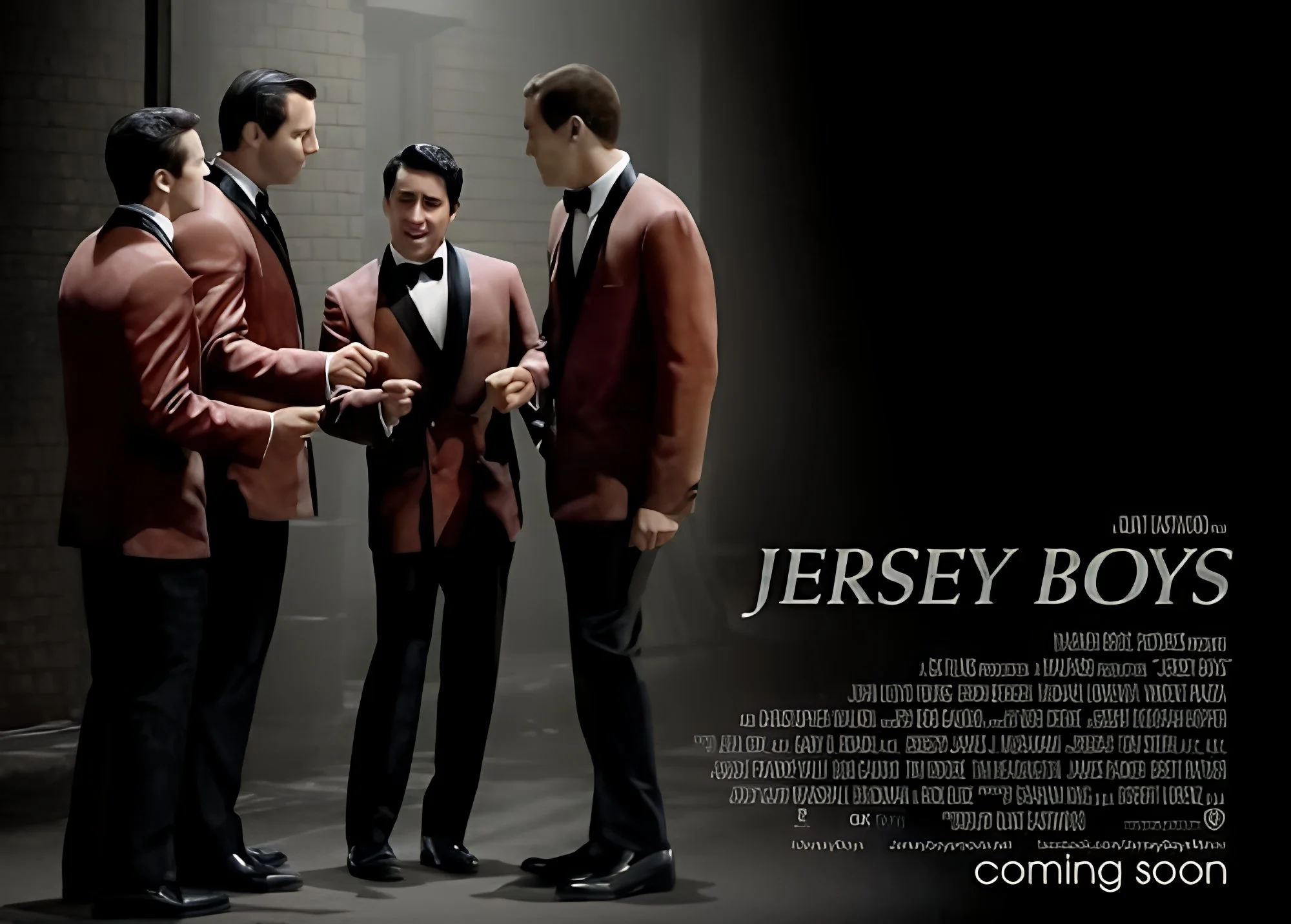 Four men dressed in pink tuxedos with black bow ties, standing in a dark hallway, engaged in conversation. There is a sign that reads "Jersey Boys" and a smaller text that says "coming soon".