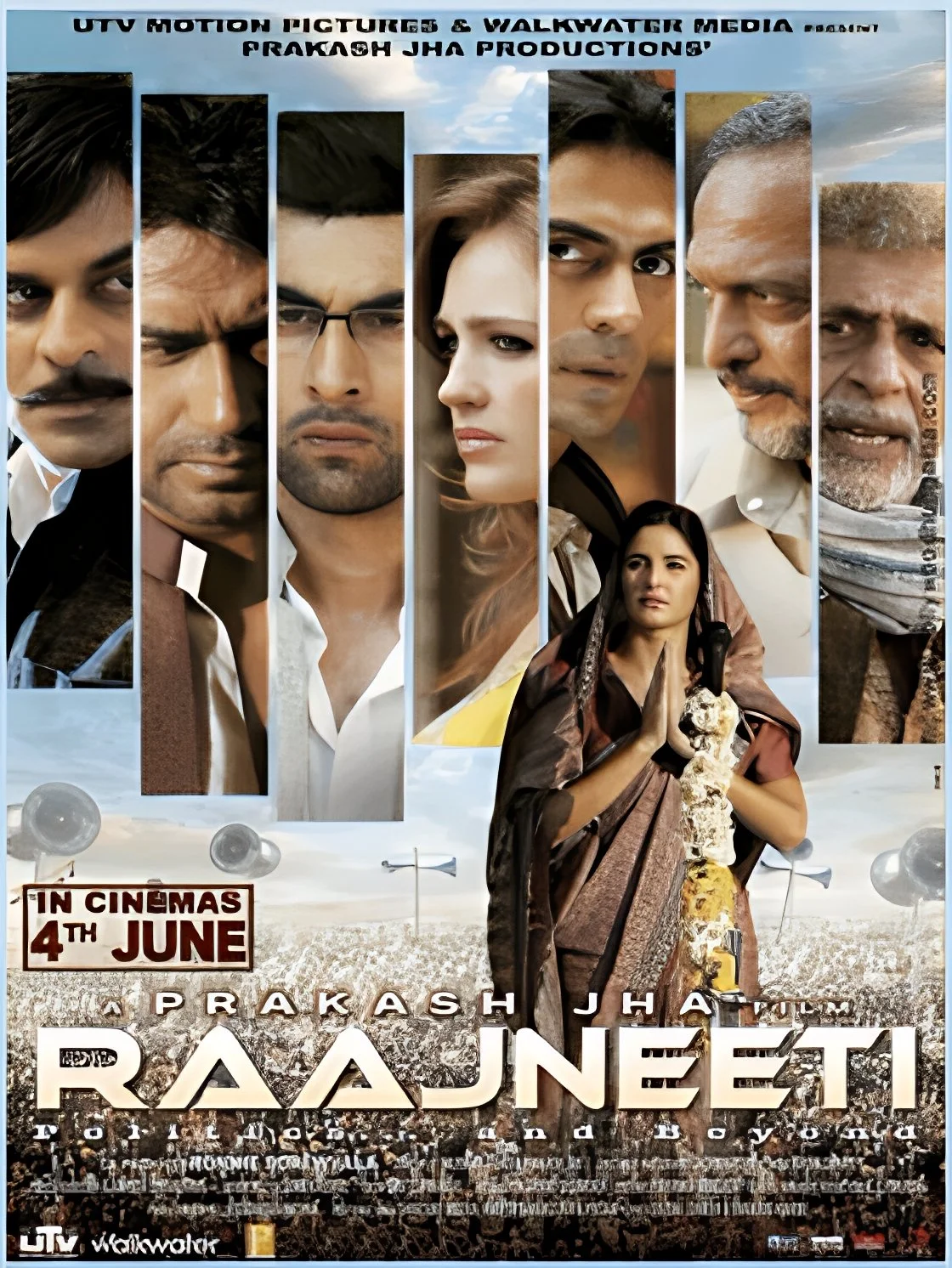 Movie poster for the film 'Raajneeti' featuring seven characters' faces, with a woman in the foreground holding flowers and praying, and a crowd at the bottom. The release date is June 4th and includes the ITV and Walkwater Media logos.
