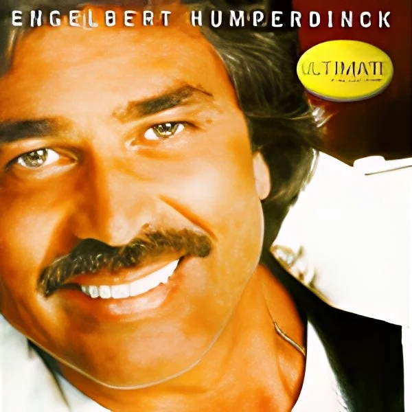 Close-up of Engelbert Humperdinck smiling, with dark hair and mustache, on album cover