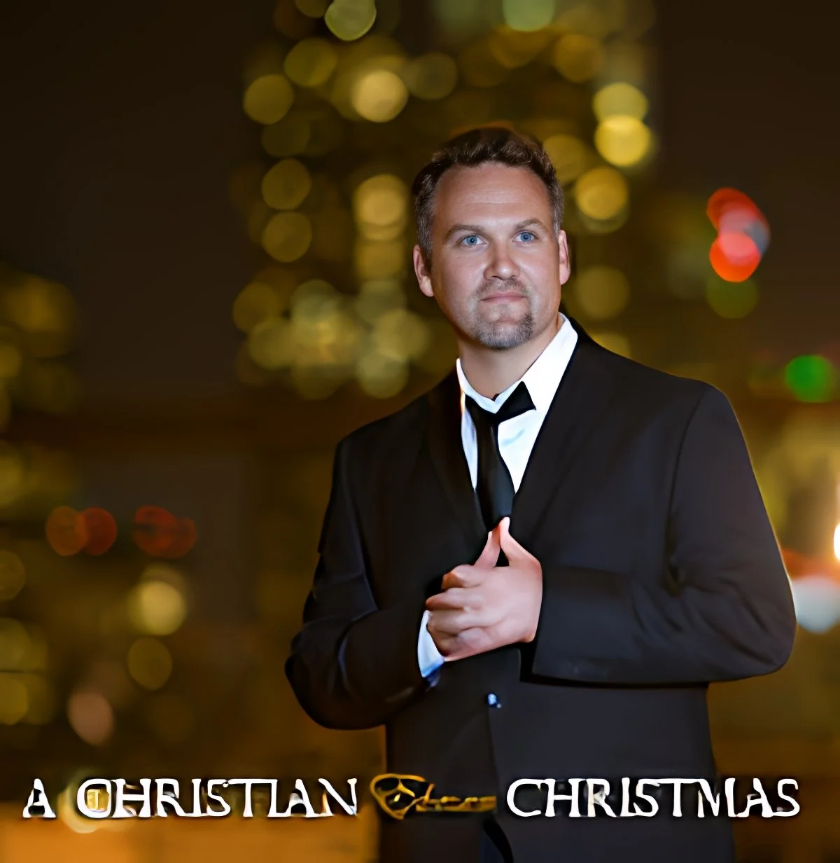 A man in a tuxedo with a black tie, standing against a background of blurred city lights at night, with the words "A Christian Christmas" at the bottom.