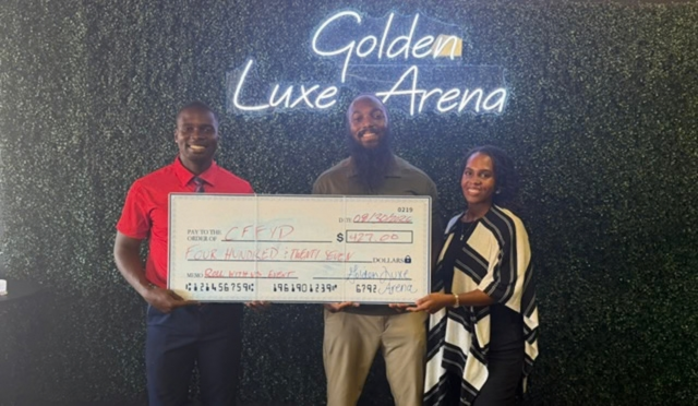 Jonathan and Camarie, founders of CFFYD, are standing with Dwight, owner of "Golden Luxe Arena," holding a large check for $427, paid to the CFFYD.