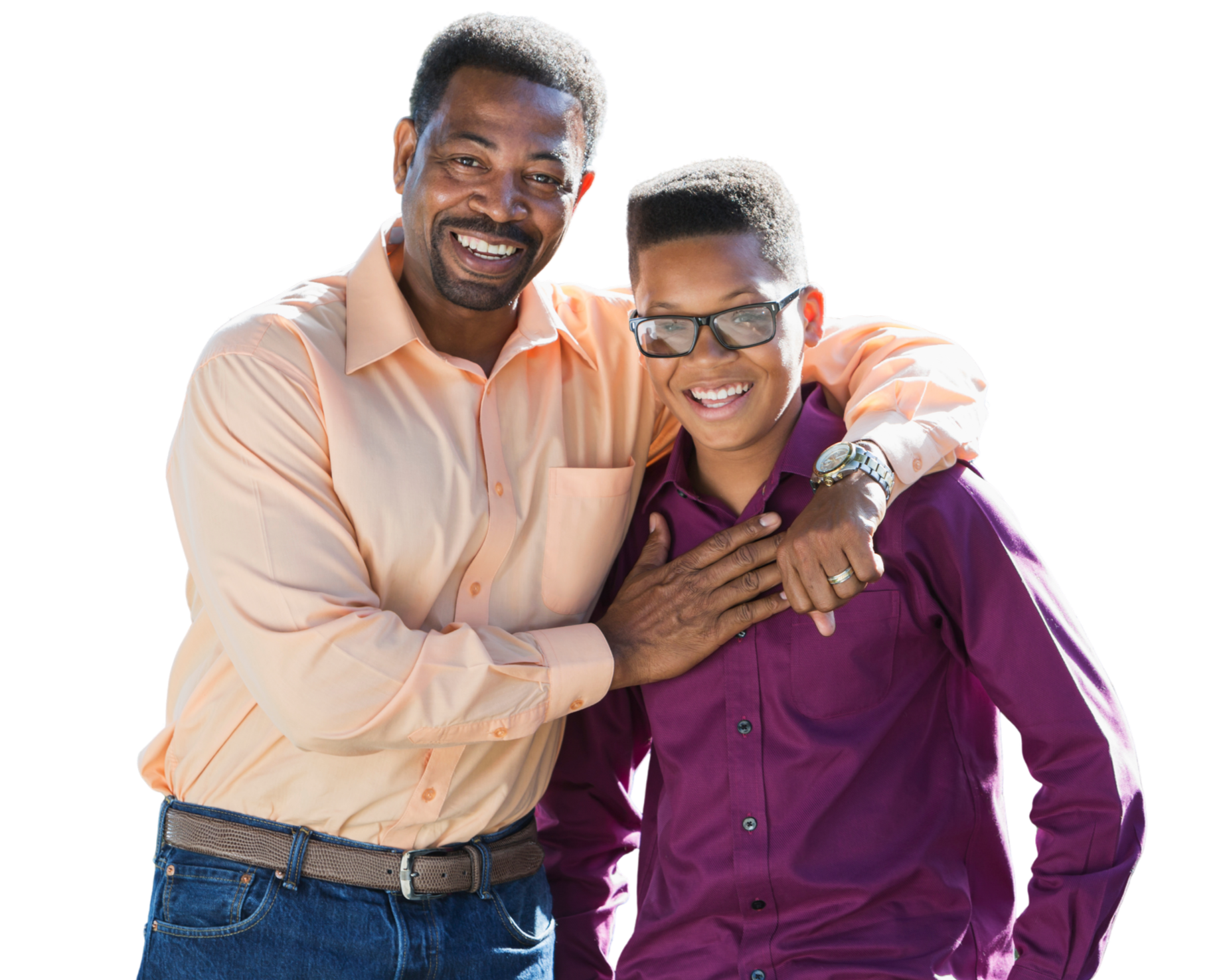 An adult man and a teenage boy smiling and embracing each other, both wearing long-sleeve shirts, with the man in a light peach shirt and the boy in a purple shirt. The man has short, dark hair with gray at the temples, and the boy has glasses and a short, textured haircut.