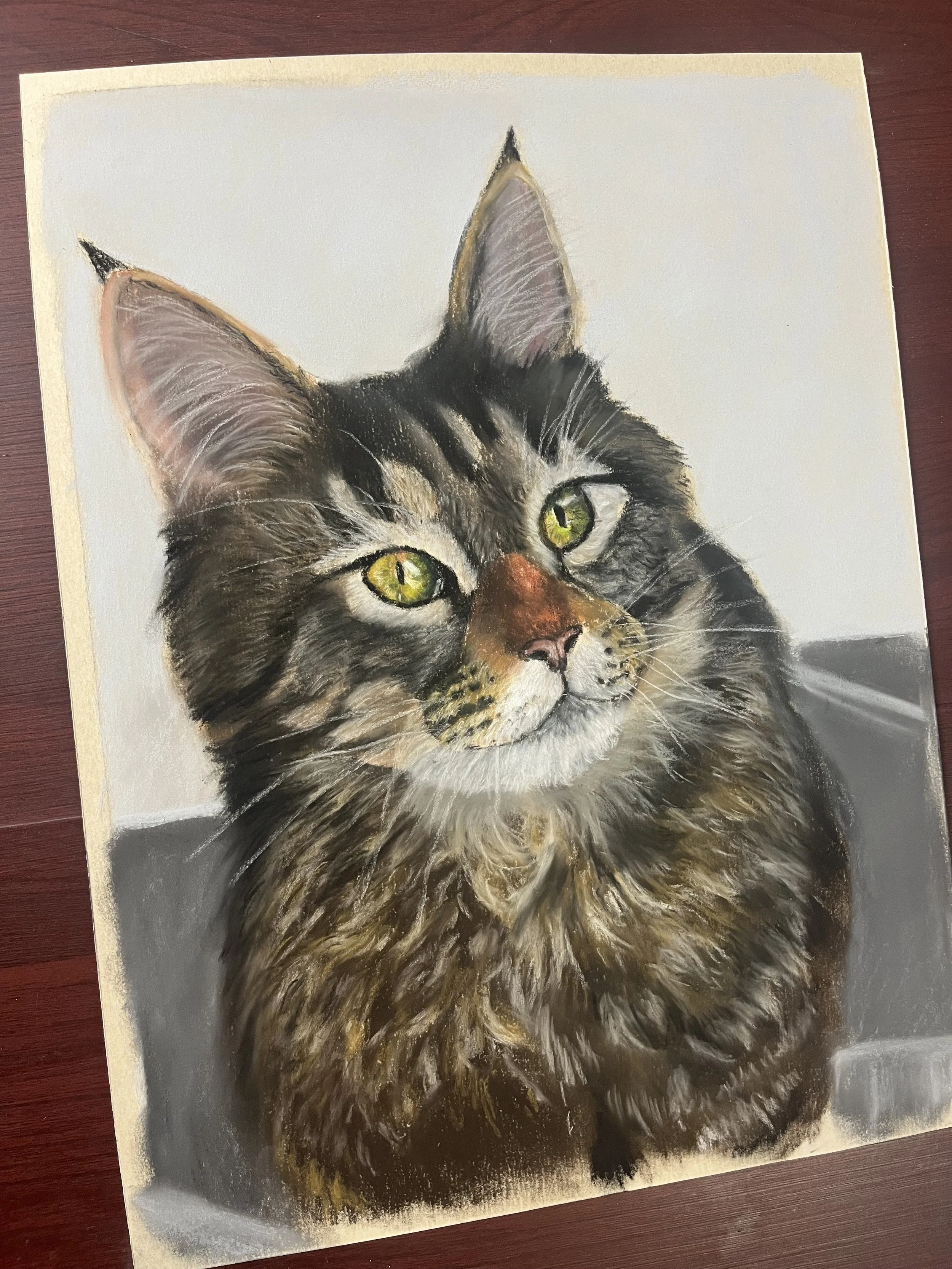 A realistic painting of a tabby cat with green eyes and detailed fur, facing forward with a neutral background.