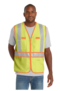 A man wearing a gray t-shirt and a yellow safety vest standing against a white background.
