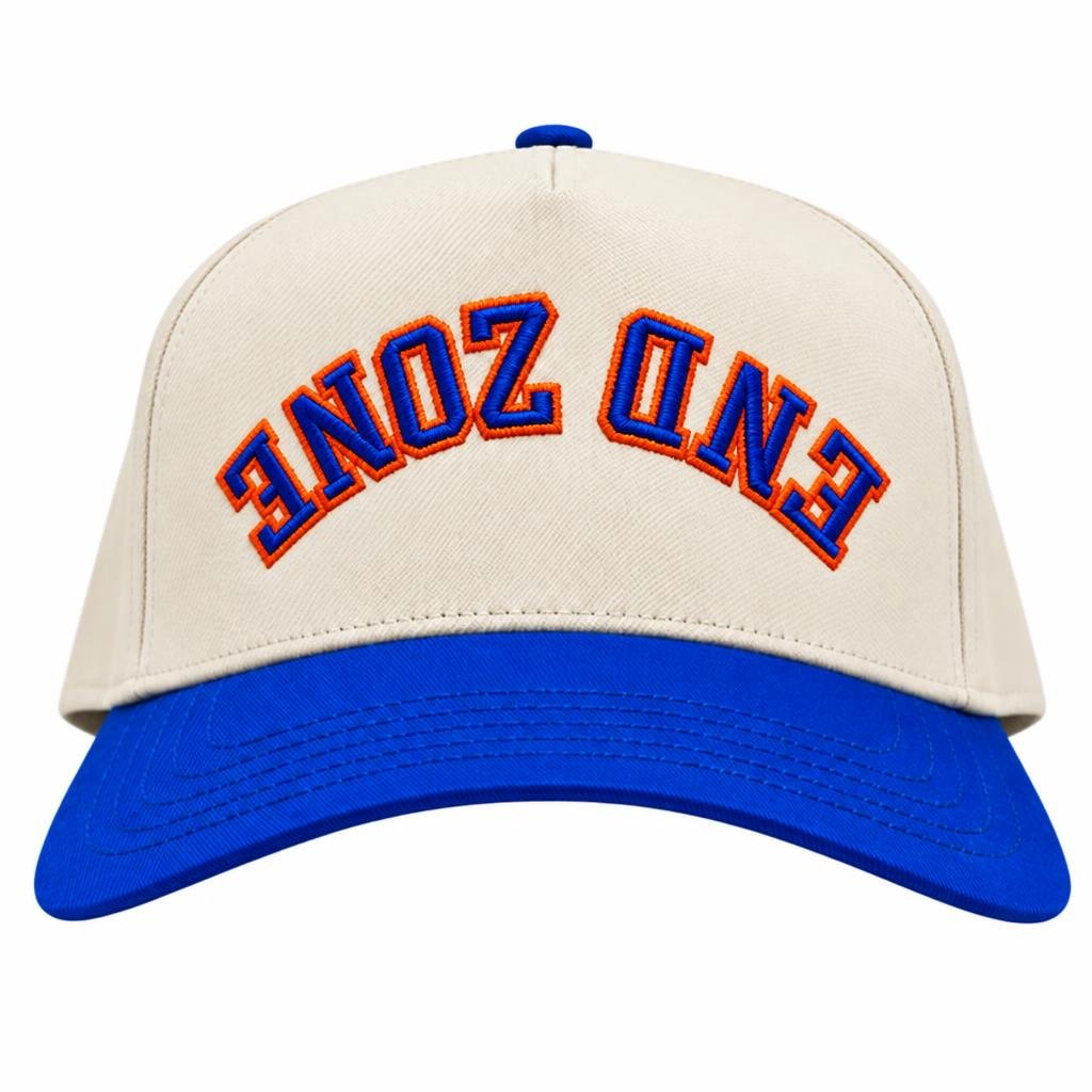 A baseball cap with a white crown, blue brim, and blue embroidered text 'ENDOZONE' on the front.