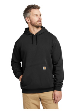 Man with a beard wearing a black hoodie and khaki pants, looking to the side against a white background.
