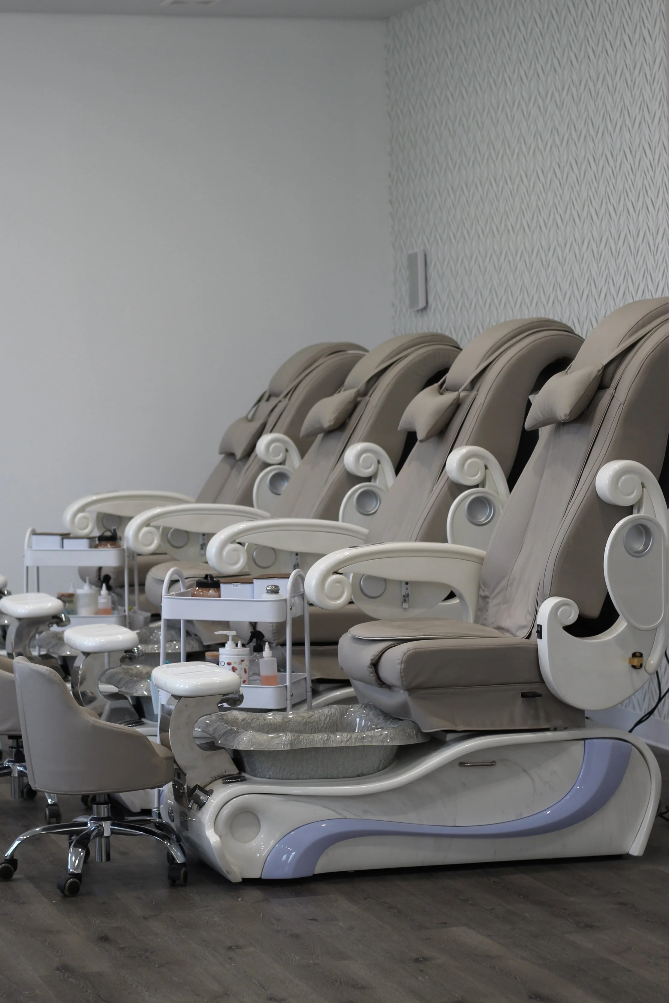 Relaxing pedicure room with multiple stations.