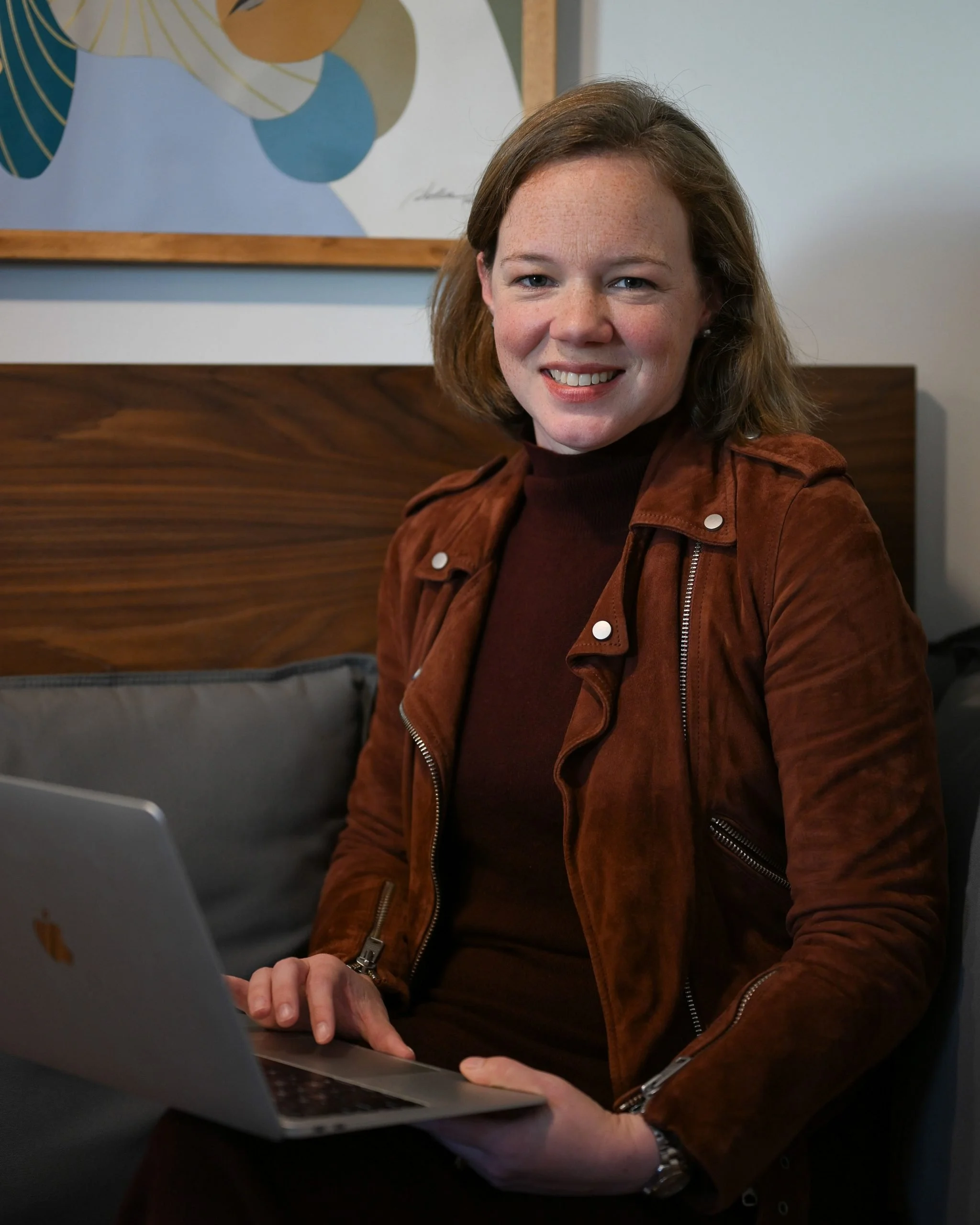 Female web designer seated with laptop