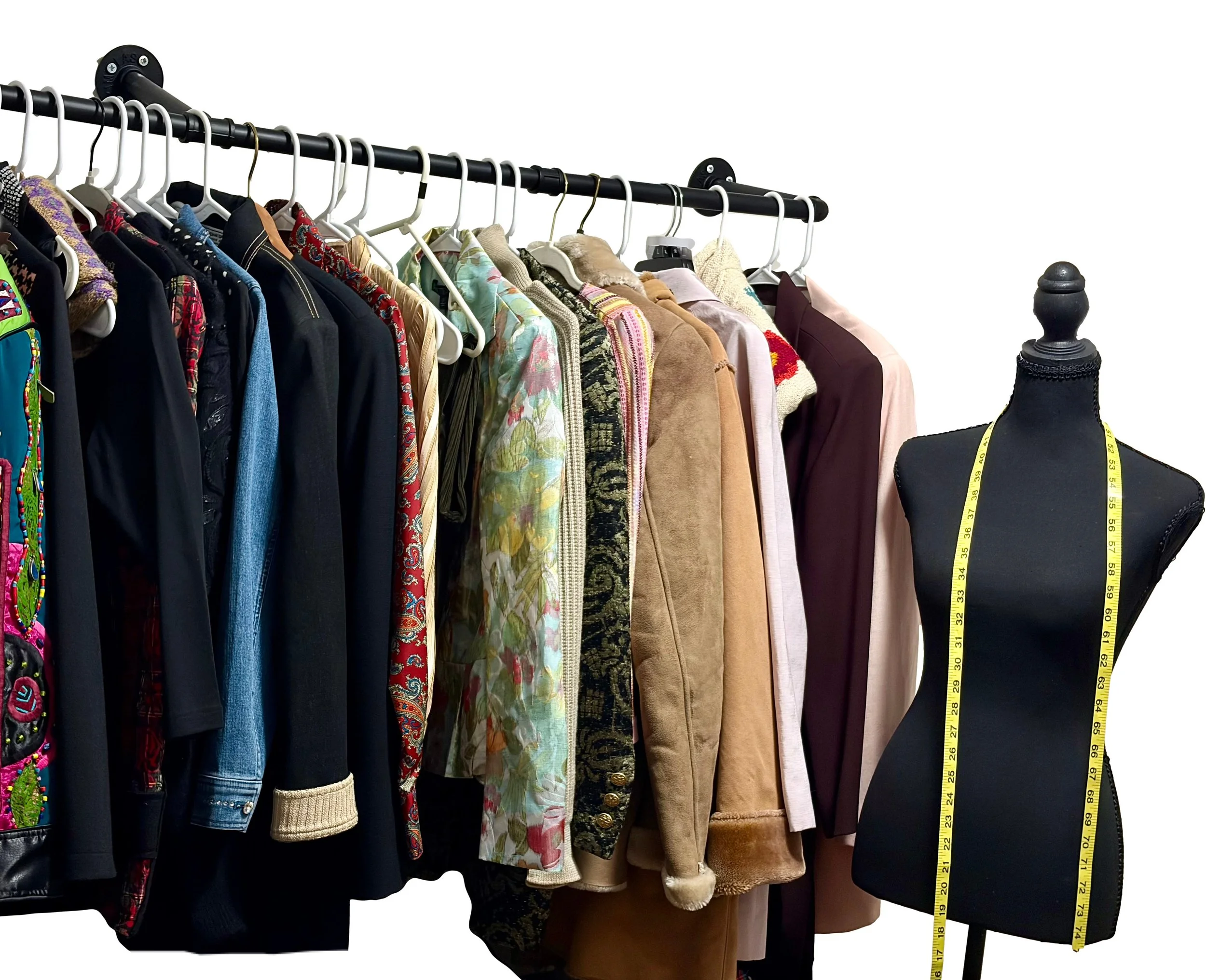 A clothing rack displaying a variety of jackets and coats in various colors and patterns, with a mannequin torso wearing a black garment and measuring tape draped around its neck on the right side.