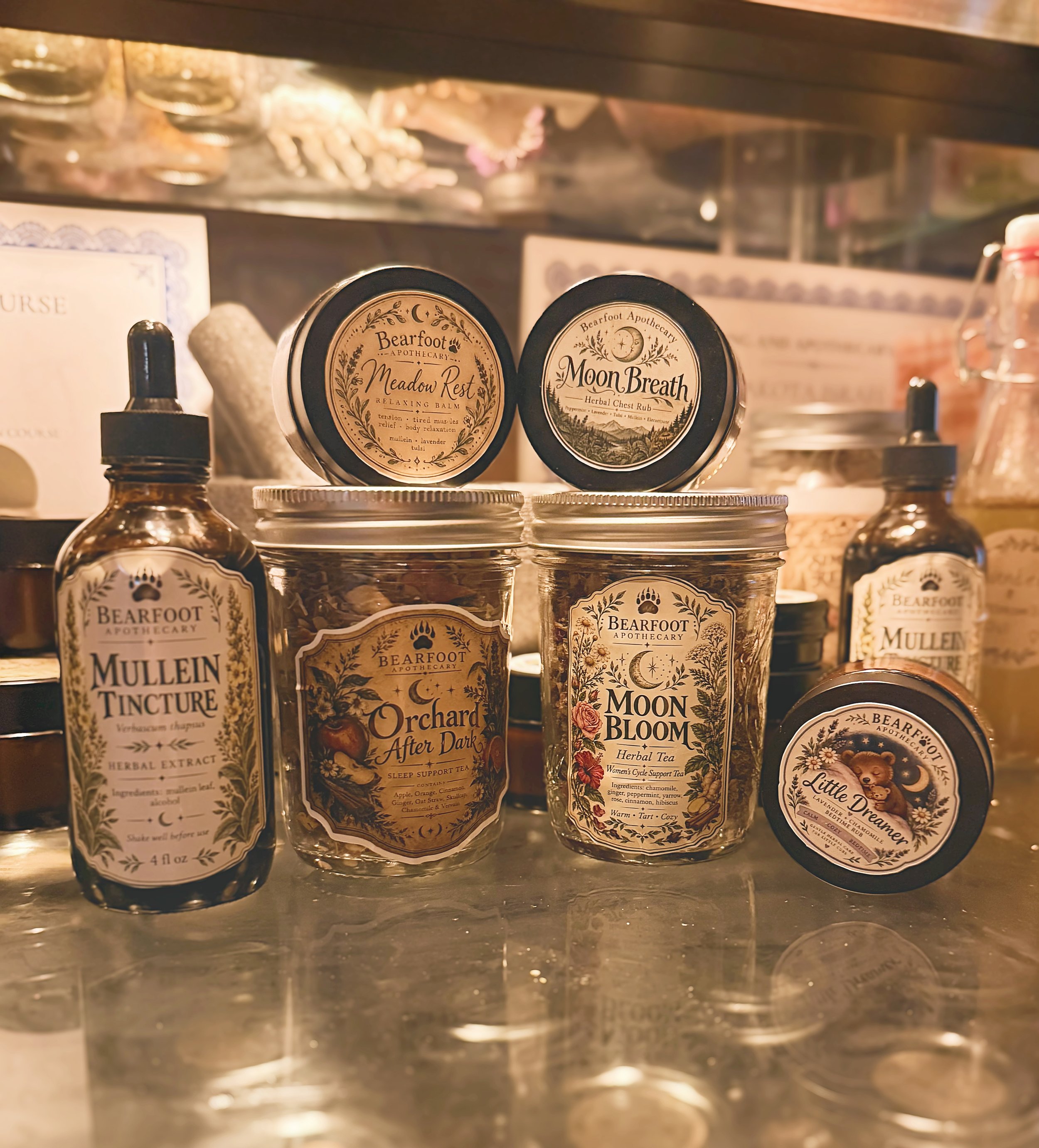 Bearfoot Apothecary herbal tinctures, teas, balms, and chest rubs displayed on a warmly lit wooden shelf.