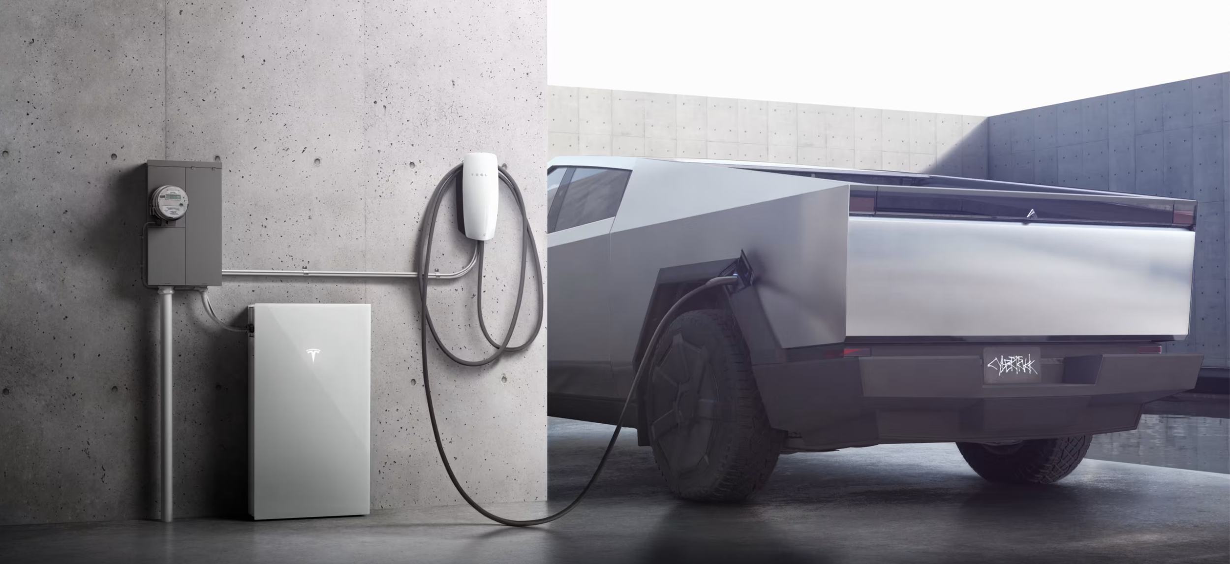 A Tesla electric vehicle charging on a concrete wall with charging equipment, including a wall-mounted charger, a charging cable, and a control box.