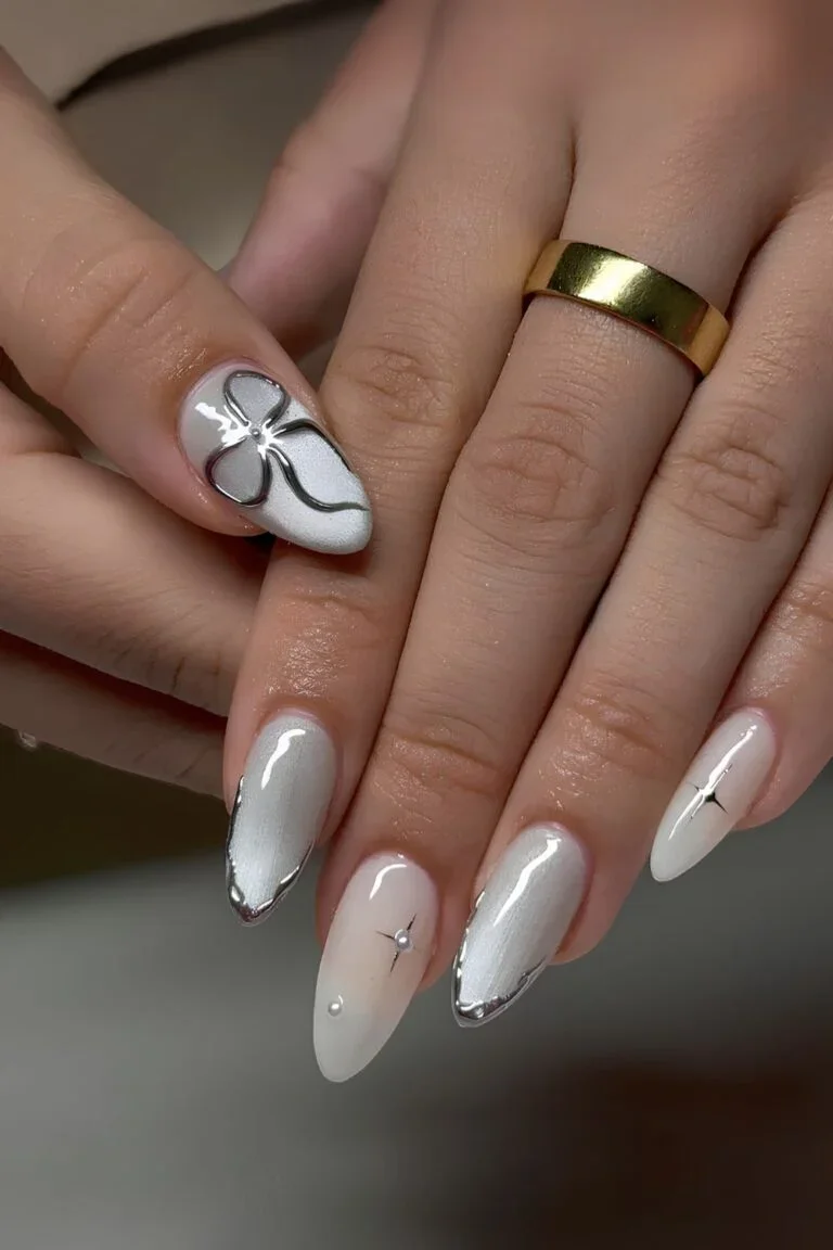 White-cat-eye-nails-with-chrome-bows-and-stars-768x1152.webp