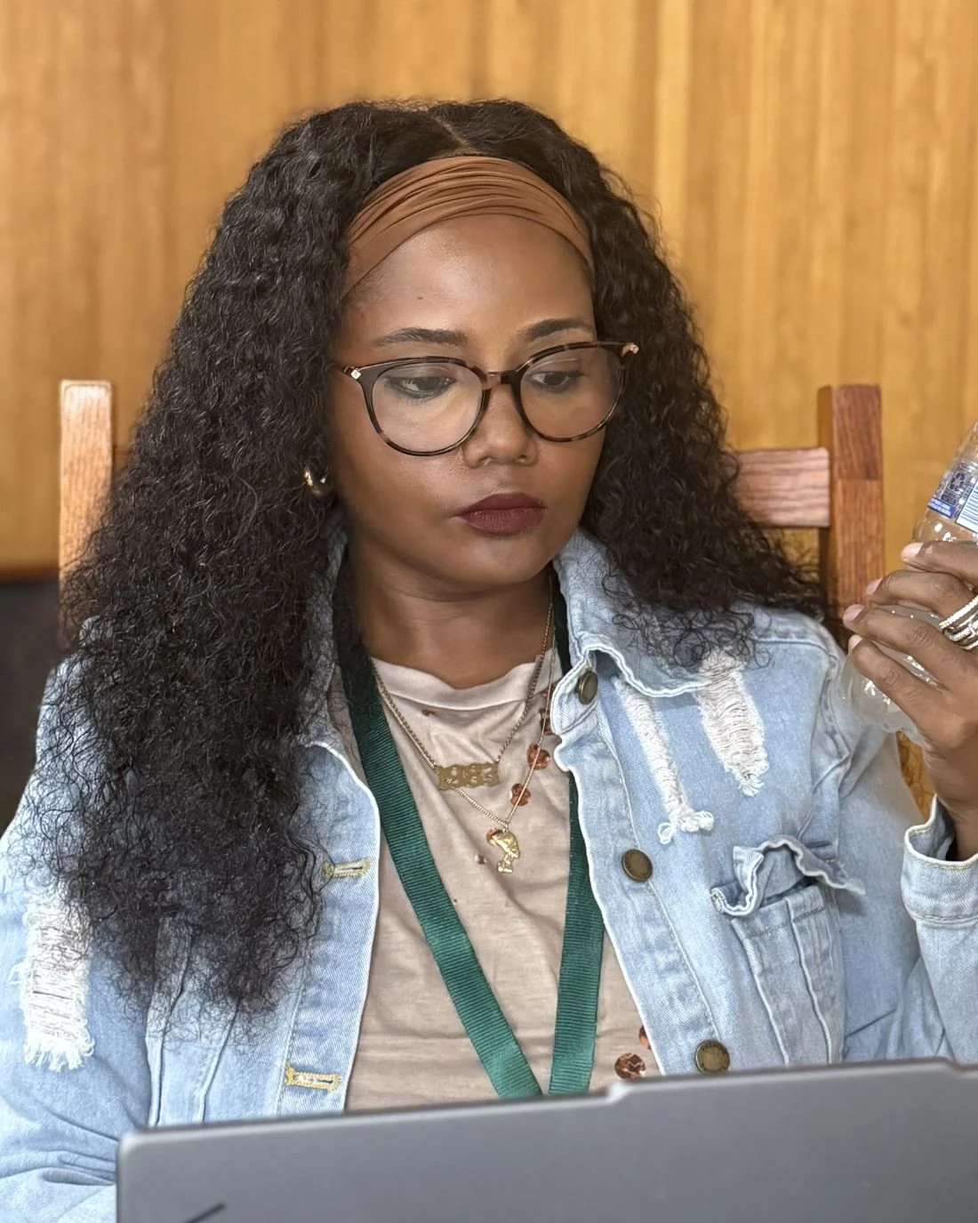 Latrina at a professional conference, working at her laptop