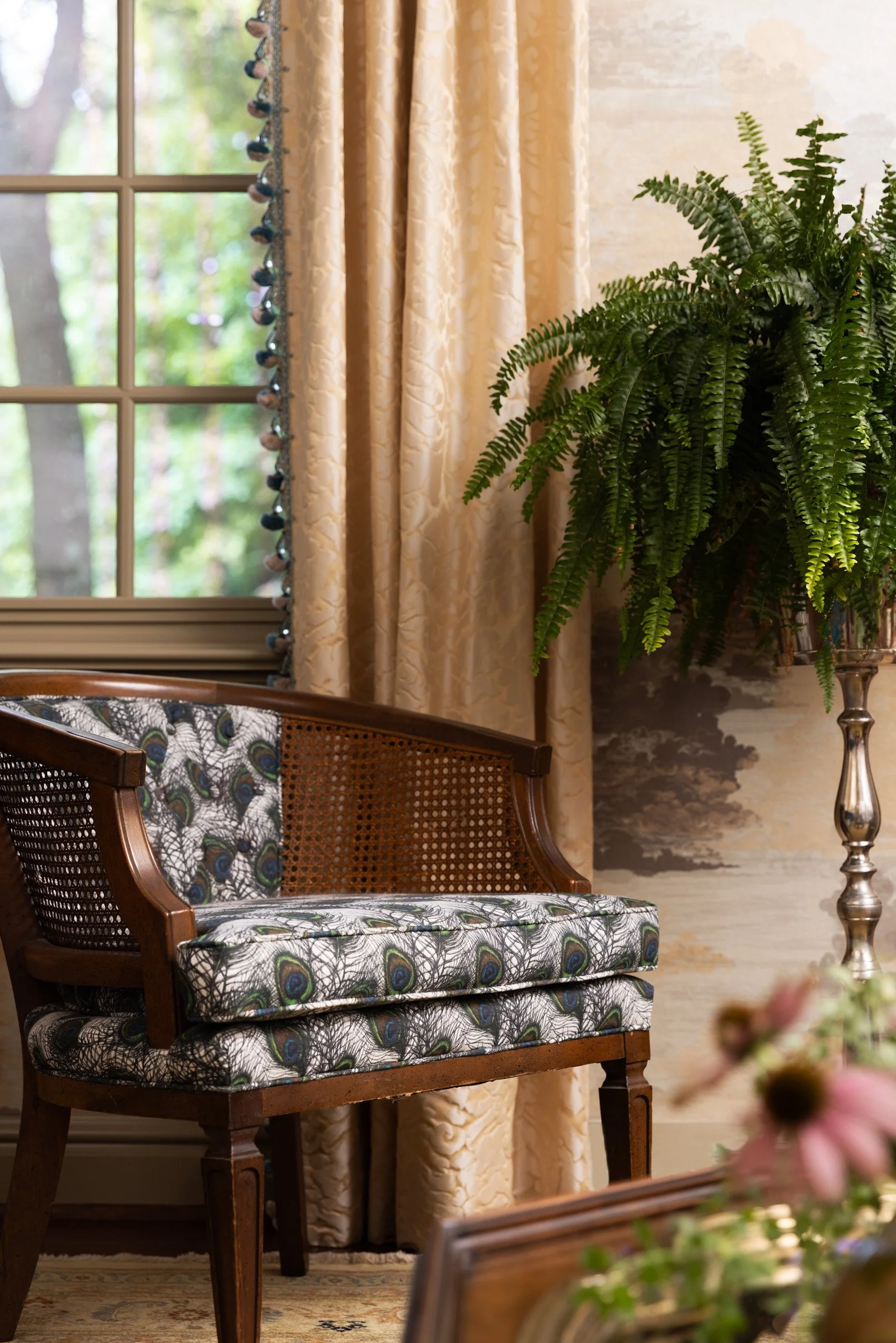 Detail of the cane-back chair and layered textiles