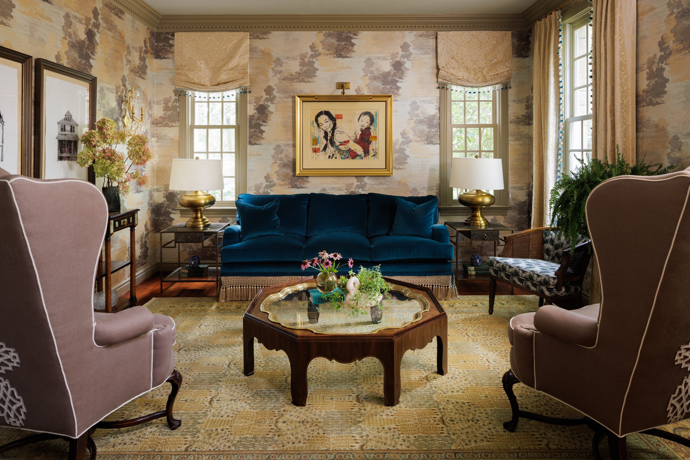 Treesdale living room with teal velvet sofa, blush chairs, layered wallpaper and custom window treatments