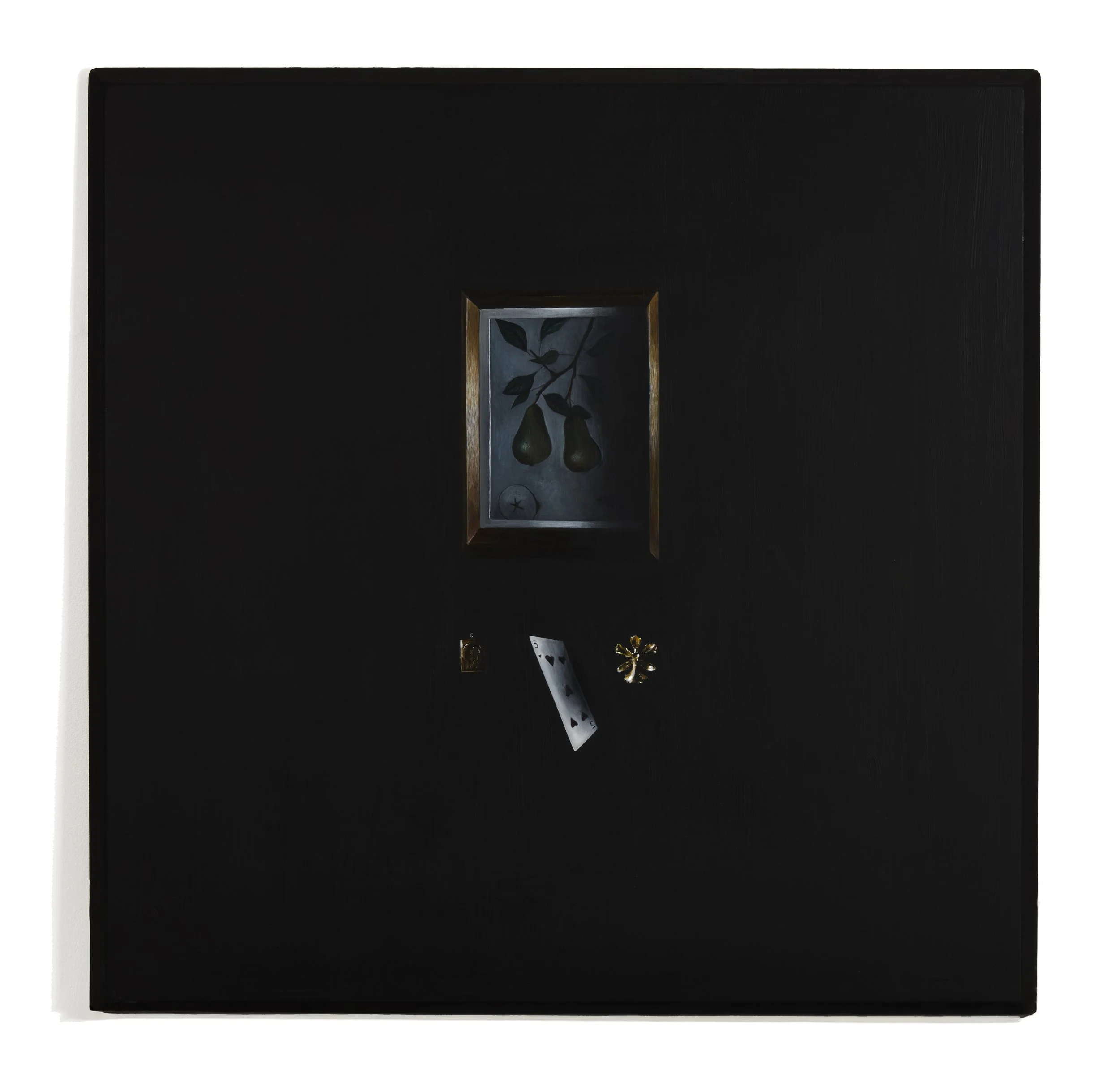 A broach, a playing card and a pendent with a small framed painting of a pear branch with leaves in the centre.