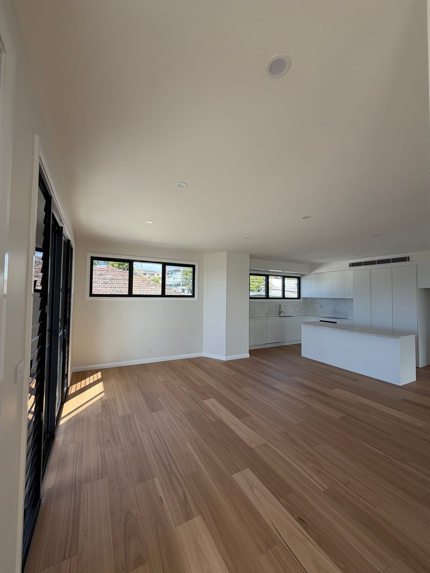 Completed open-plan interior with freshly painted walls and ceilings by Crossy and Crew