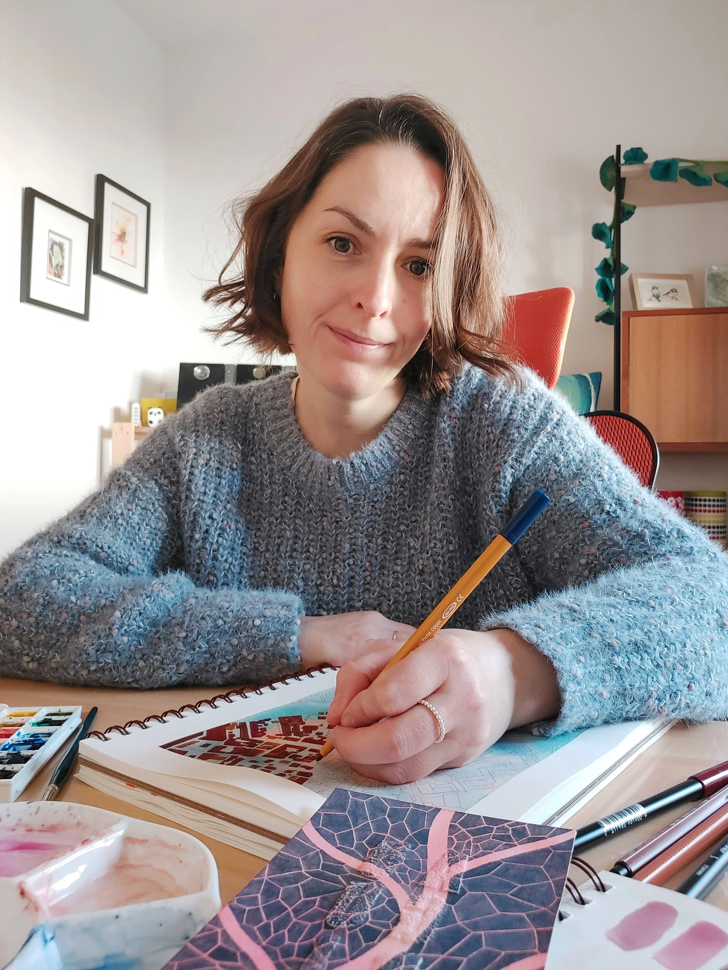 Portrait photograph of mixed media artist Joanna Ritchie in her home studio in Italy.