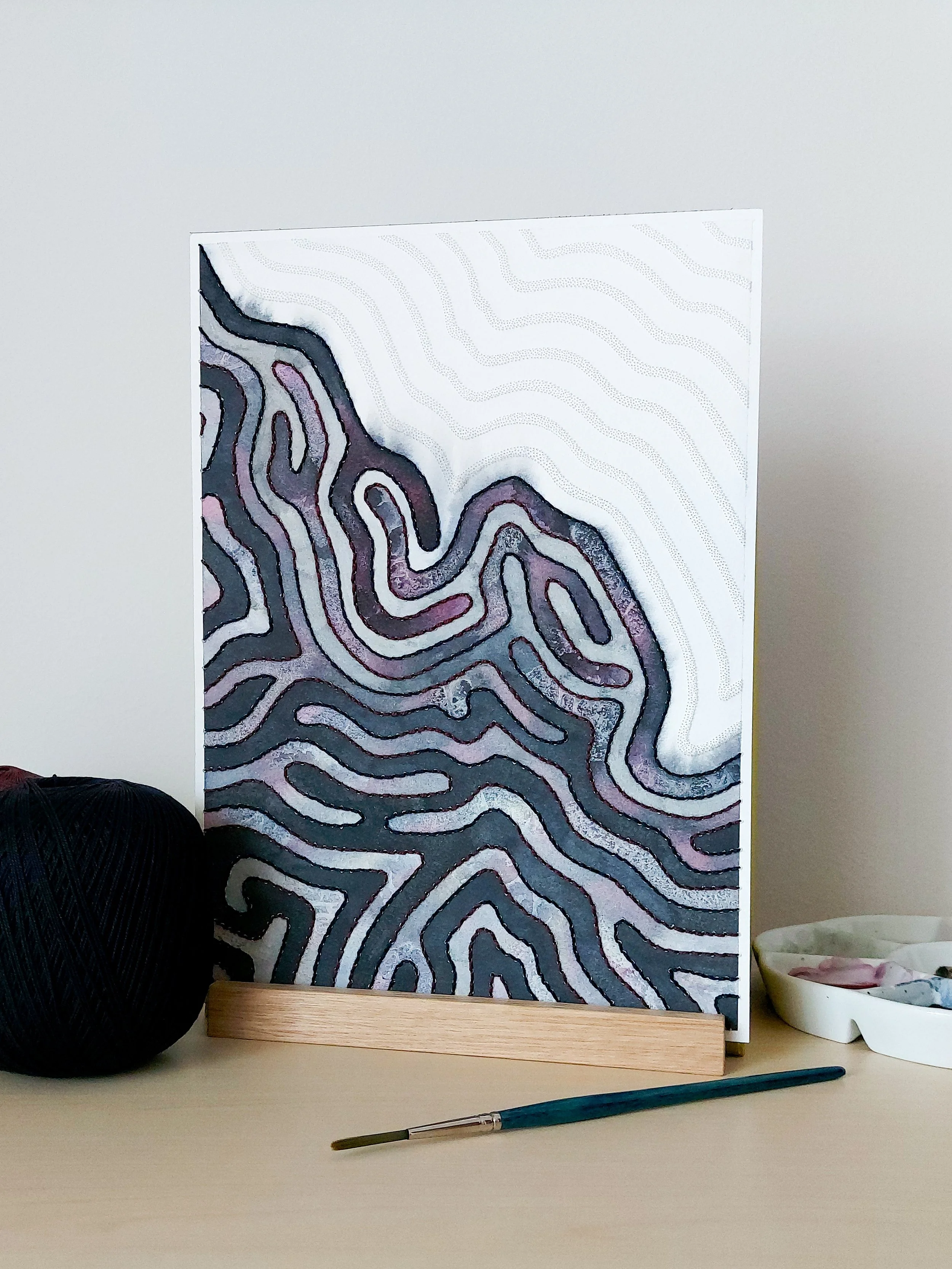"Without resolution" - an original abstract artwork created by mixed media artist Joanna Ritchie using watercolour and paper embroidery techniques in shades of dark blue and purple.
