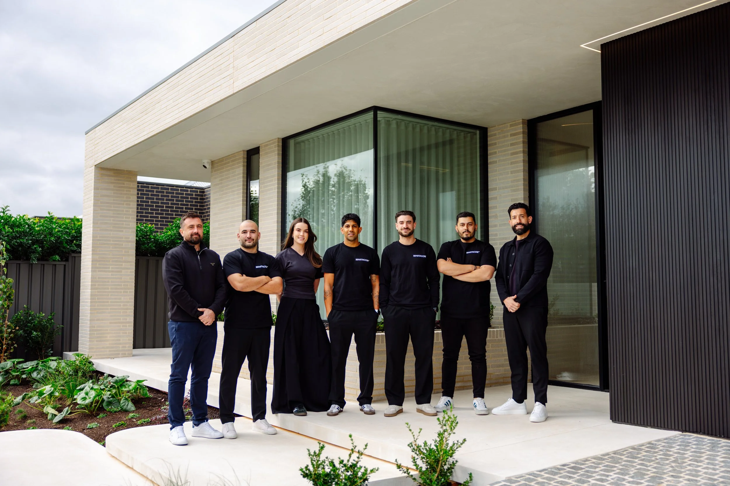 The Mastacon team outside a contemporary brick home in Adelaide