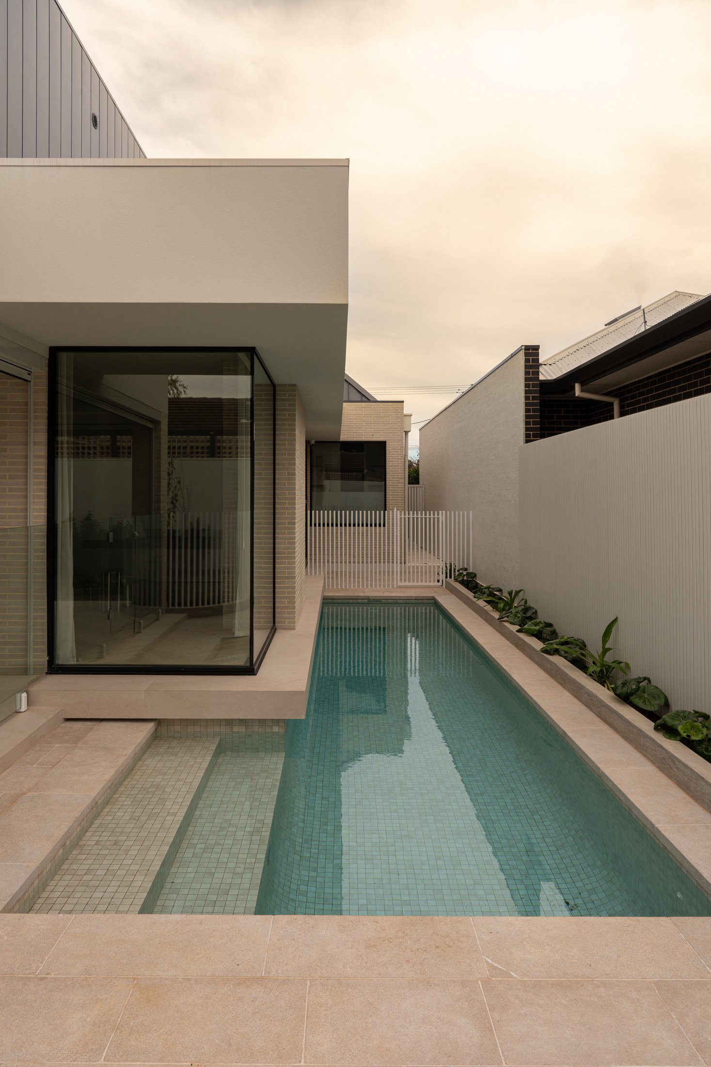 Narrow swimming pool alongside the St Morris home
