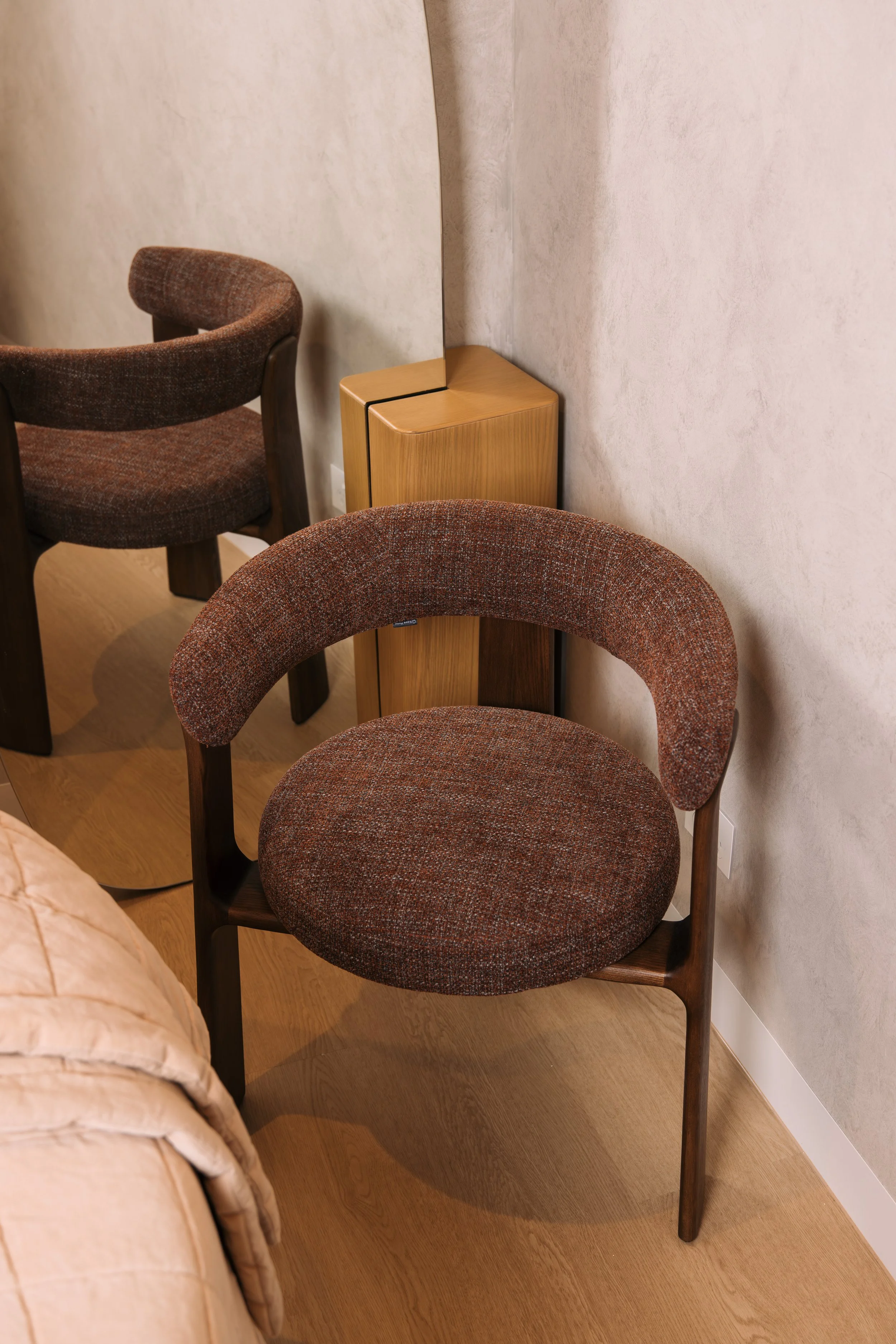 Textured upholstered chairs in the Elixir Skin Fitness reception