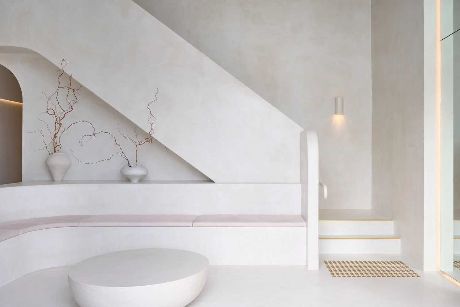 Sculpt Skin Clinic reception with a curved counter and minimal furnishings