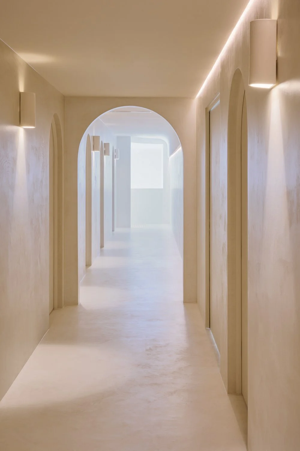 Arched doorways and sheer-curtained window at Sculpt Skin Clinic