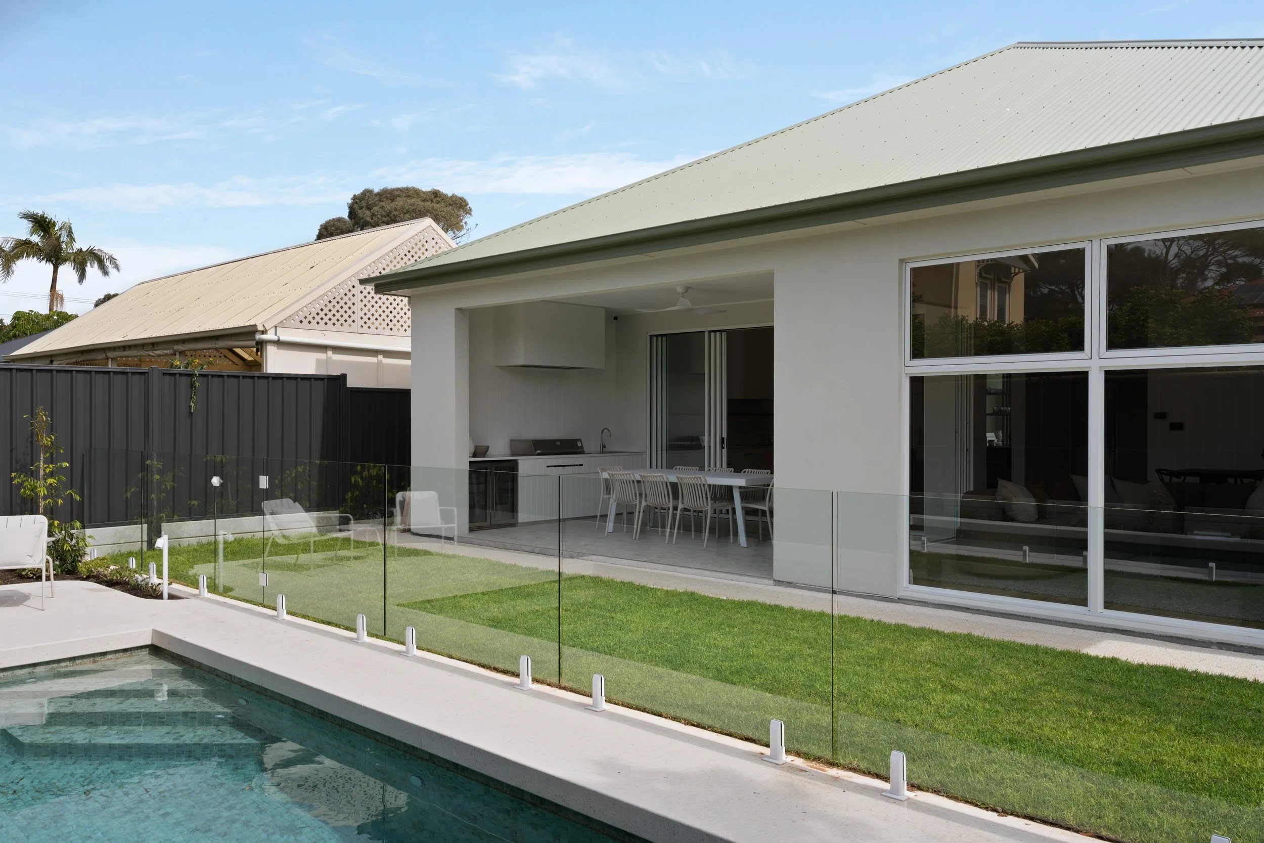 Rear elevation and covered outdoor dining area at Glenelg North