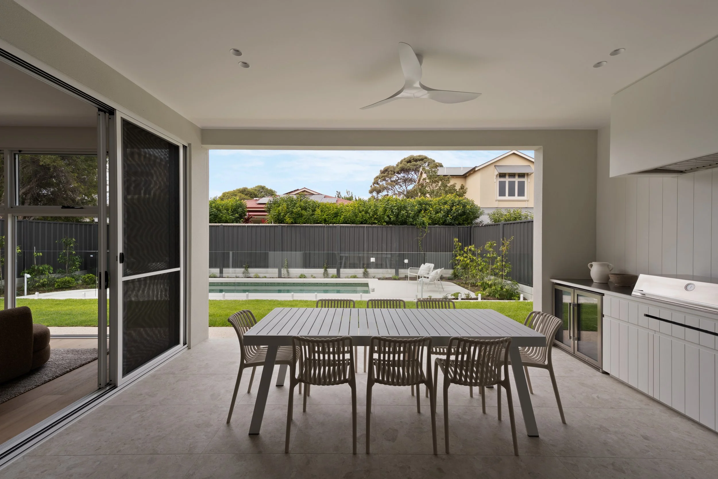 Outdoor dining table beneath the covered terrace in Glenelg North