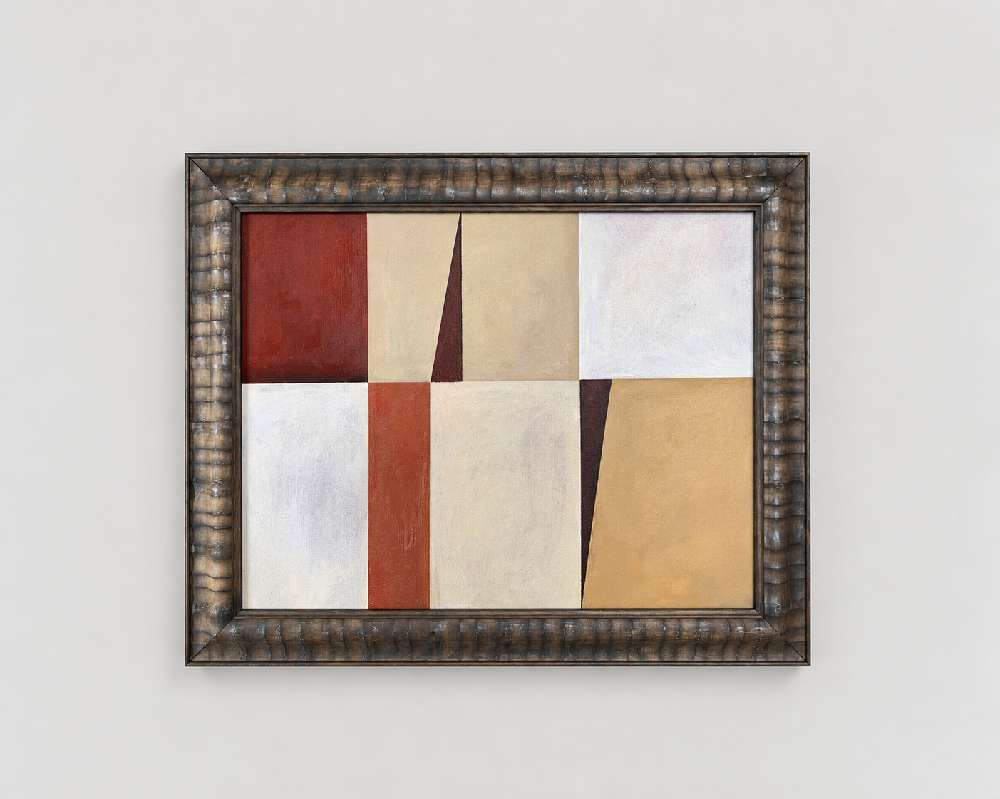 An abstract painting with geometric shapes and muted colors, framed in a dark uniquely textured frame, hanging on a white wall.