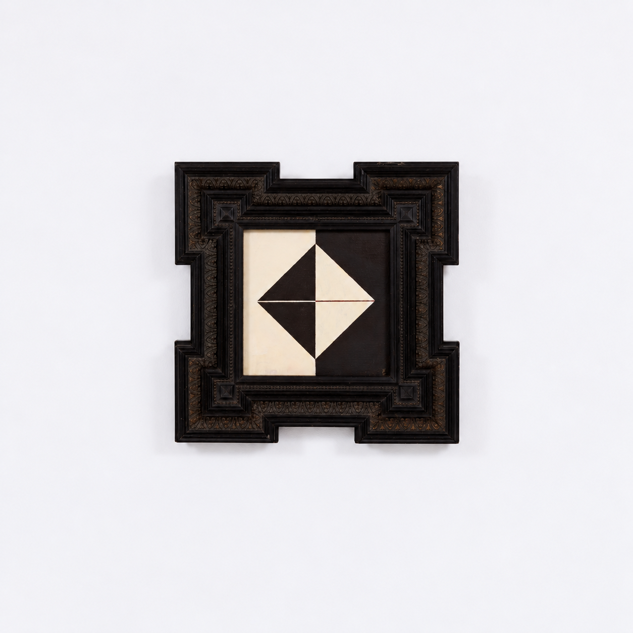 Contemporary wall art featuring a black and white geometric diamond pattern in a decorative dark wood frame.