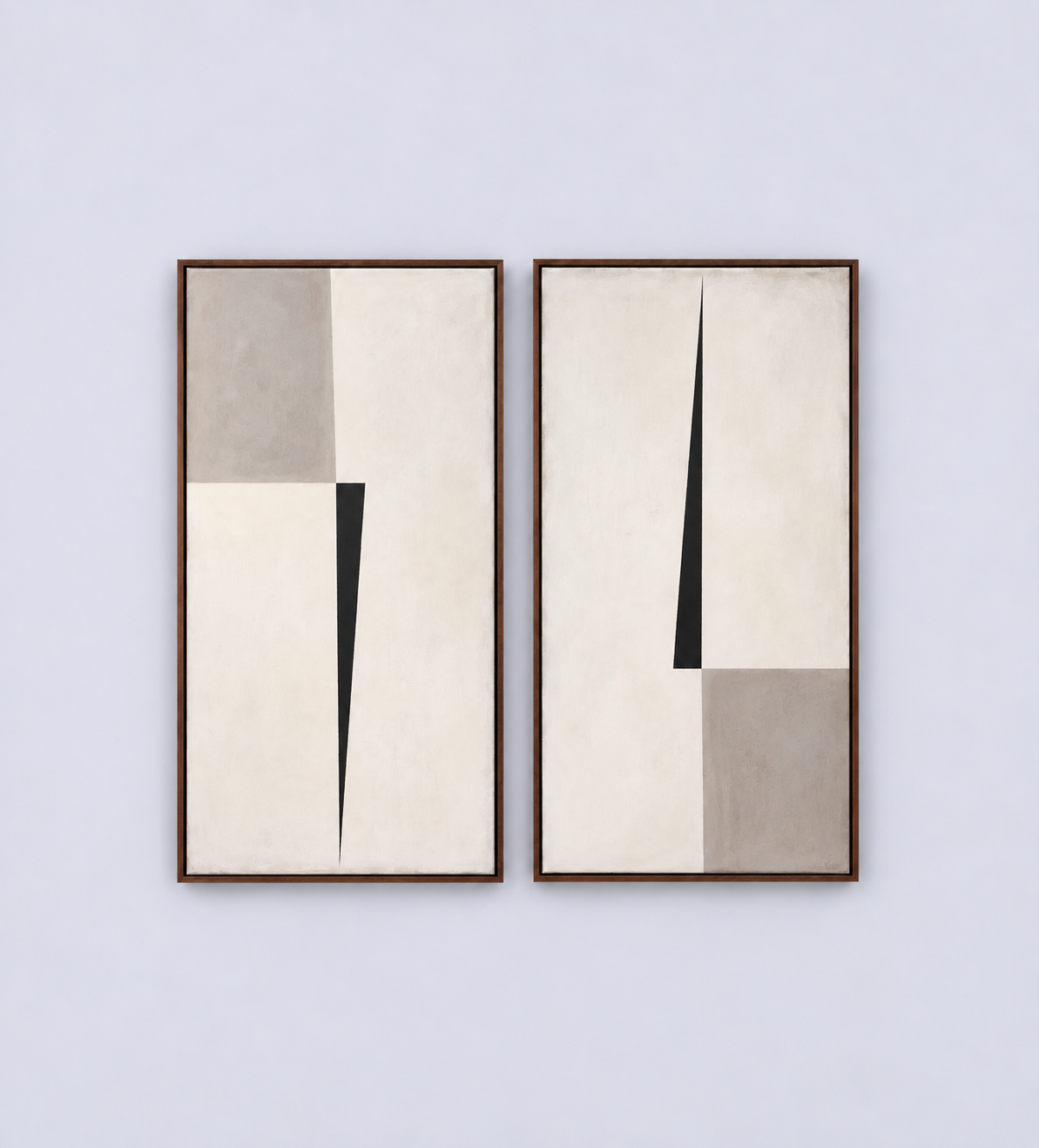 Two minimalist abstract paintings with black, white, and gray geometric shapes, framed and hung side by side on a white wall.