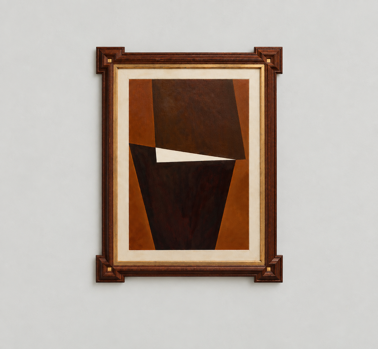 Abstract geometric painting with dark brown, black, and white shapes in an Edwardian antique wooden frame displayed on a plain white wall.