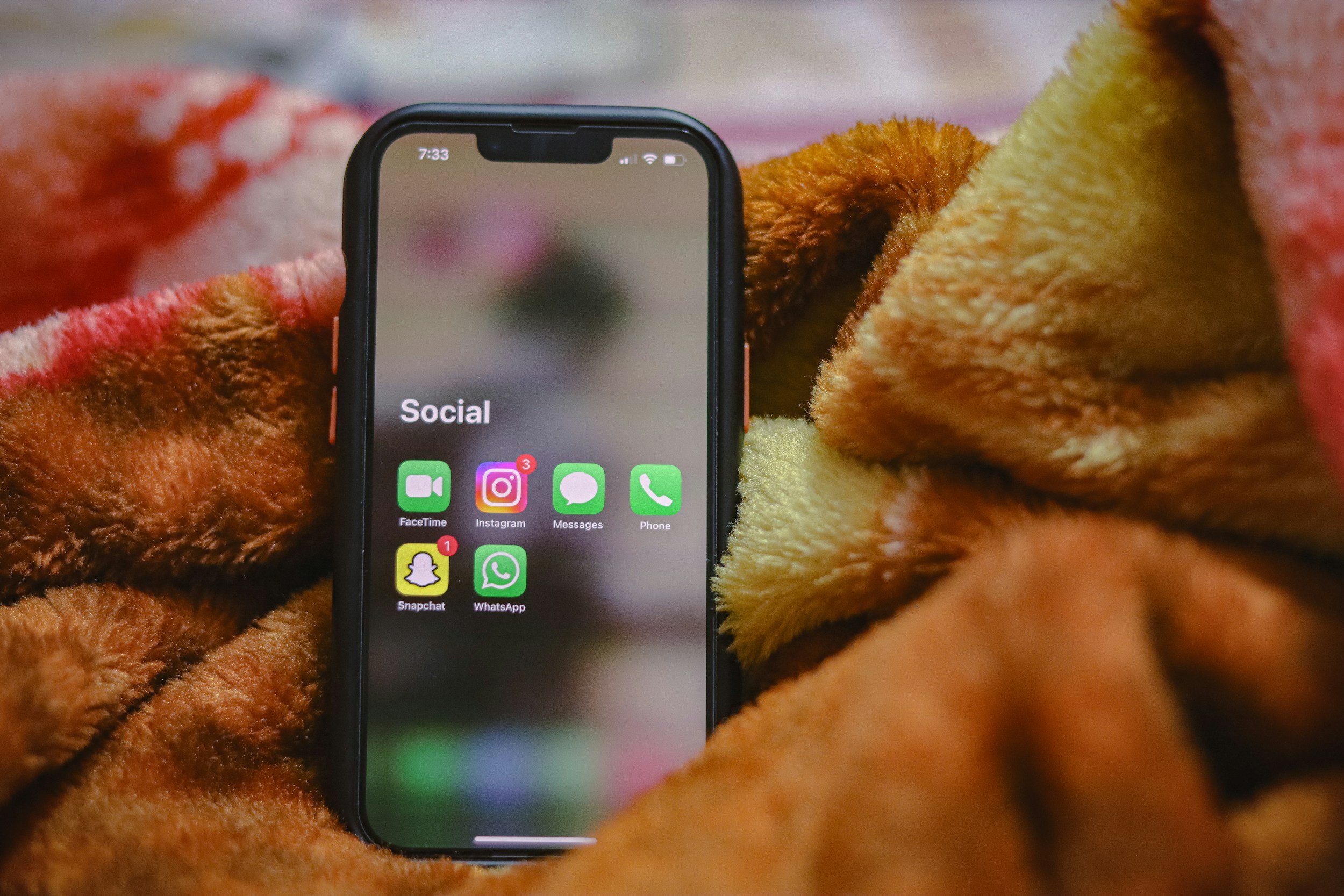 Close-up of a smartphone displaying social media apps