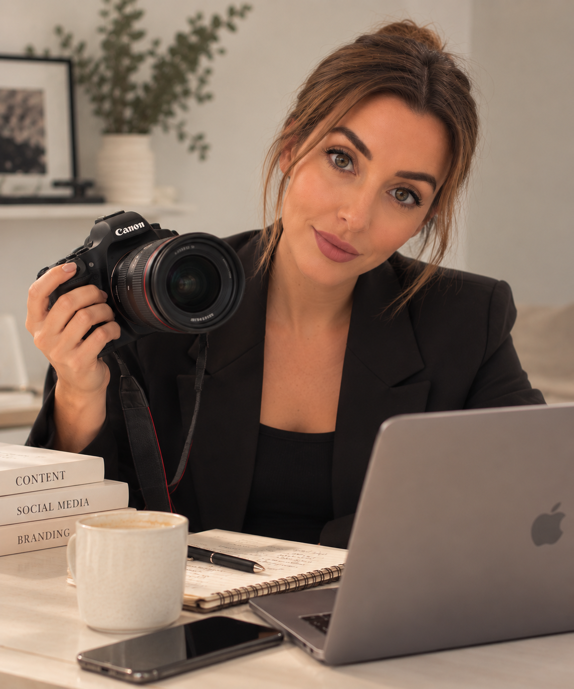 Twenty Nine Studio photographer and content creator working with camera at desk