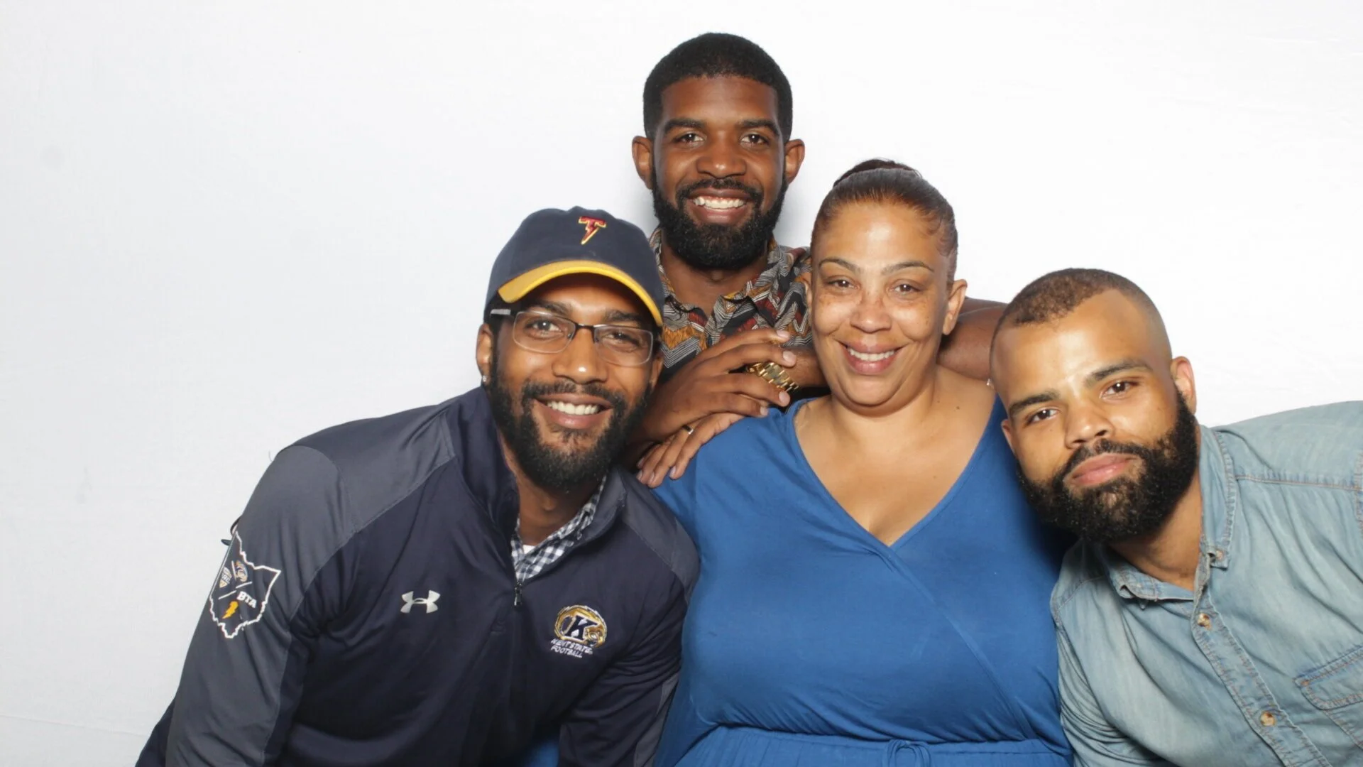 The GoodVibez family team smiling together.