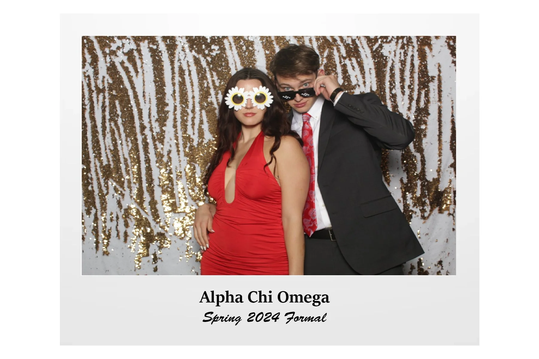 Two young adults in formal attire posing in front of a gold sequin backdrop, with one wearing festive sunglasses with daisies and the other wearing pixelated sunglasses, promoting the Alpha Chi Omega Spring 2024 Formal event.