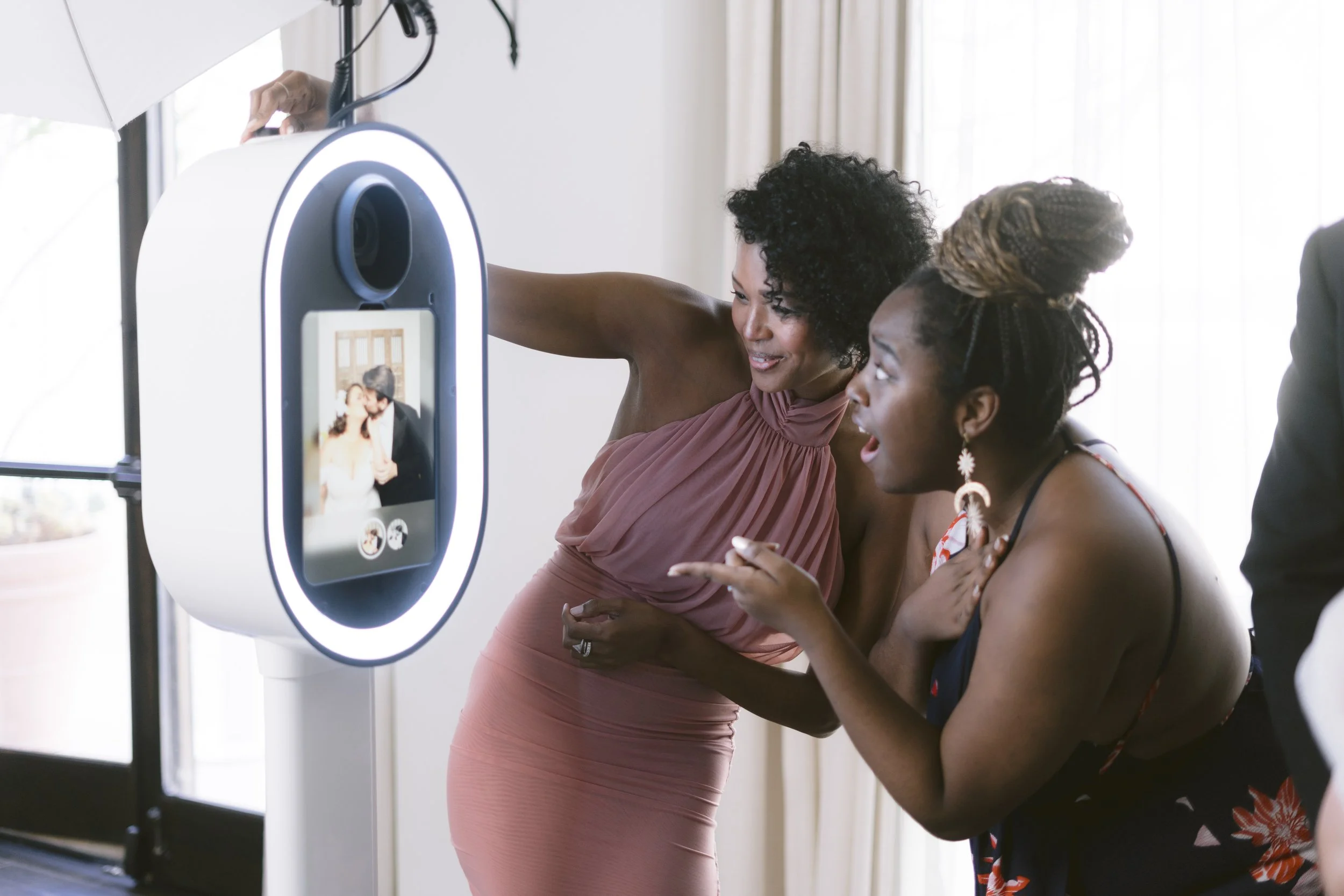 Studio Print Booth with integrated lighting, touchscreen and printer, shown as a preview of the upcoming GoodVibez experience.