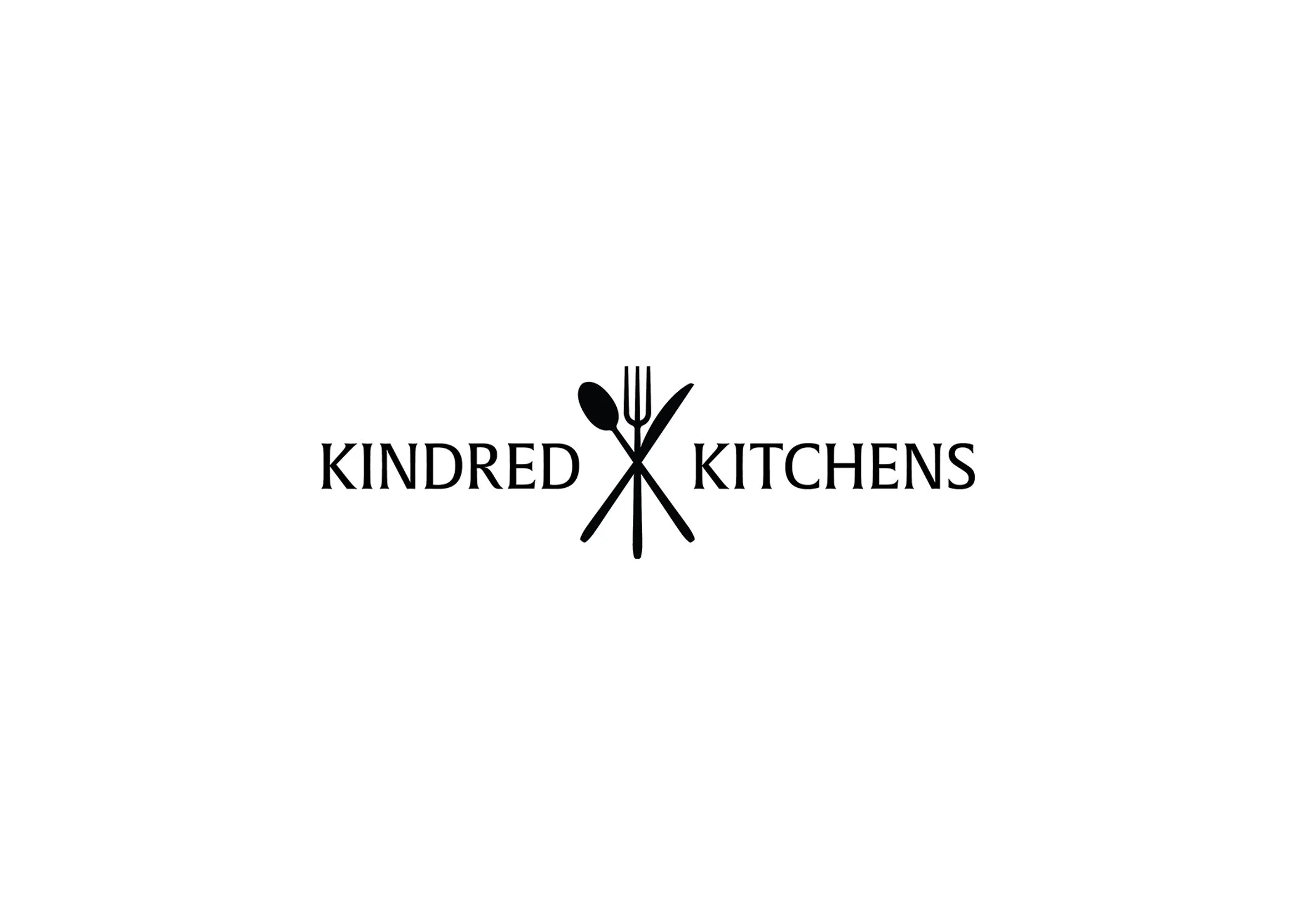 A white background with a black logo of a fork, spoon, and knife crossed in the center. Below the logo are the words 'KINDRED KITCHENS' in black capital letters.