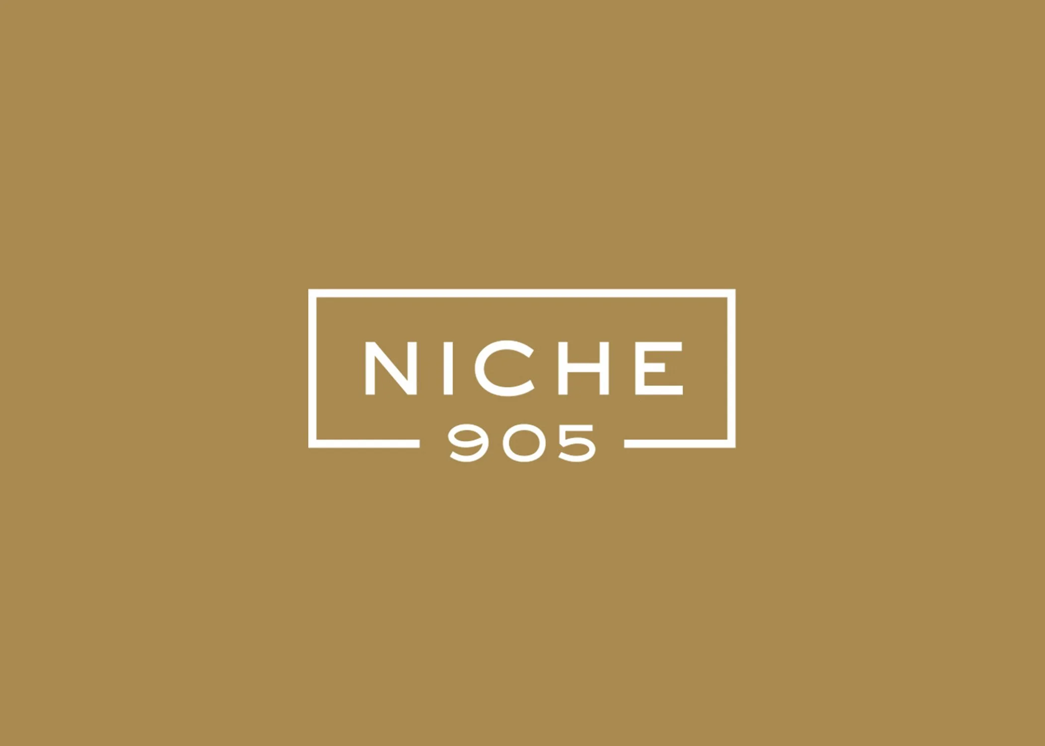 Logo with the text 'NICHE 905' on a brown background.