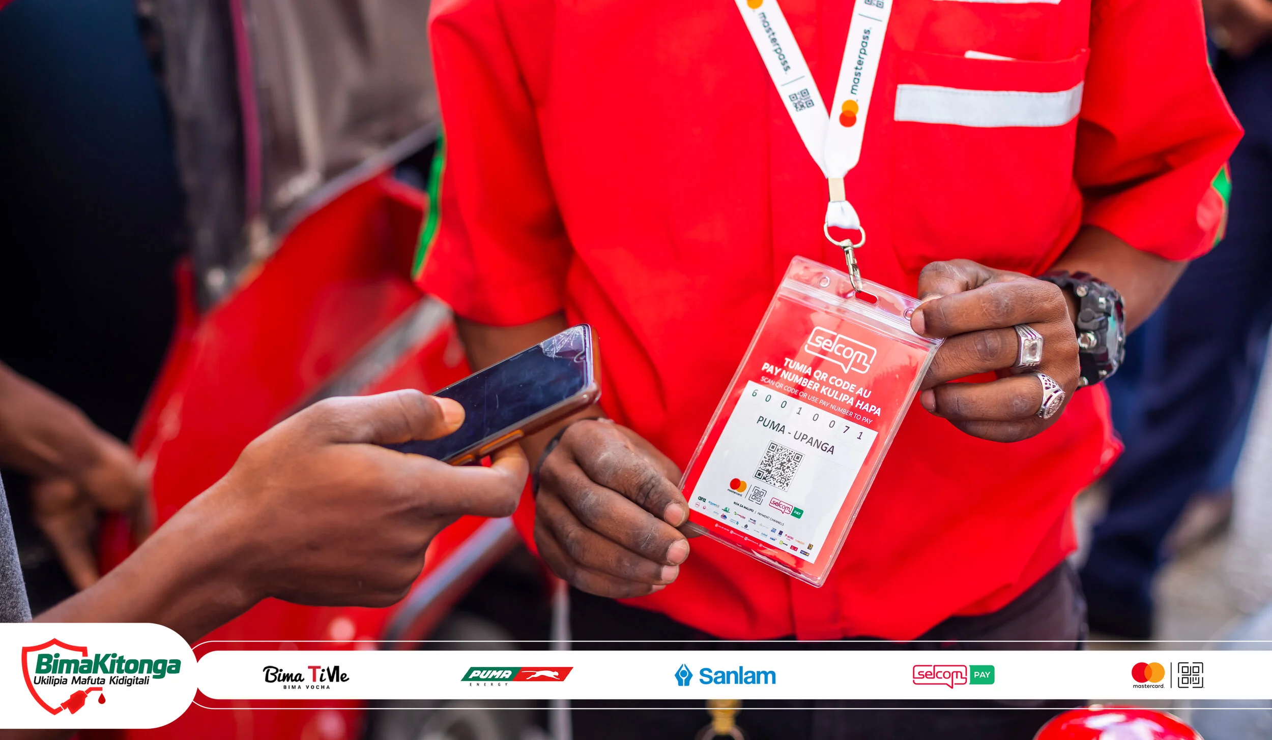 A Bajaj driver pays for fuel at the Puma Energy service station in Upanga using Selcom Pay MCQR to access 7-day life insurance cover by Sanlam.