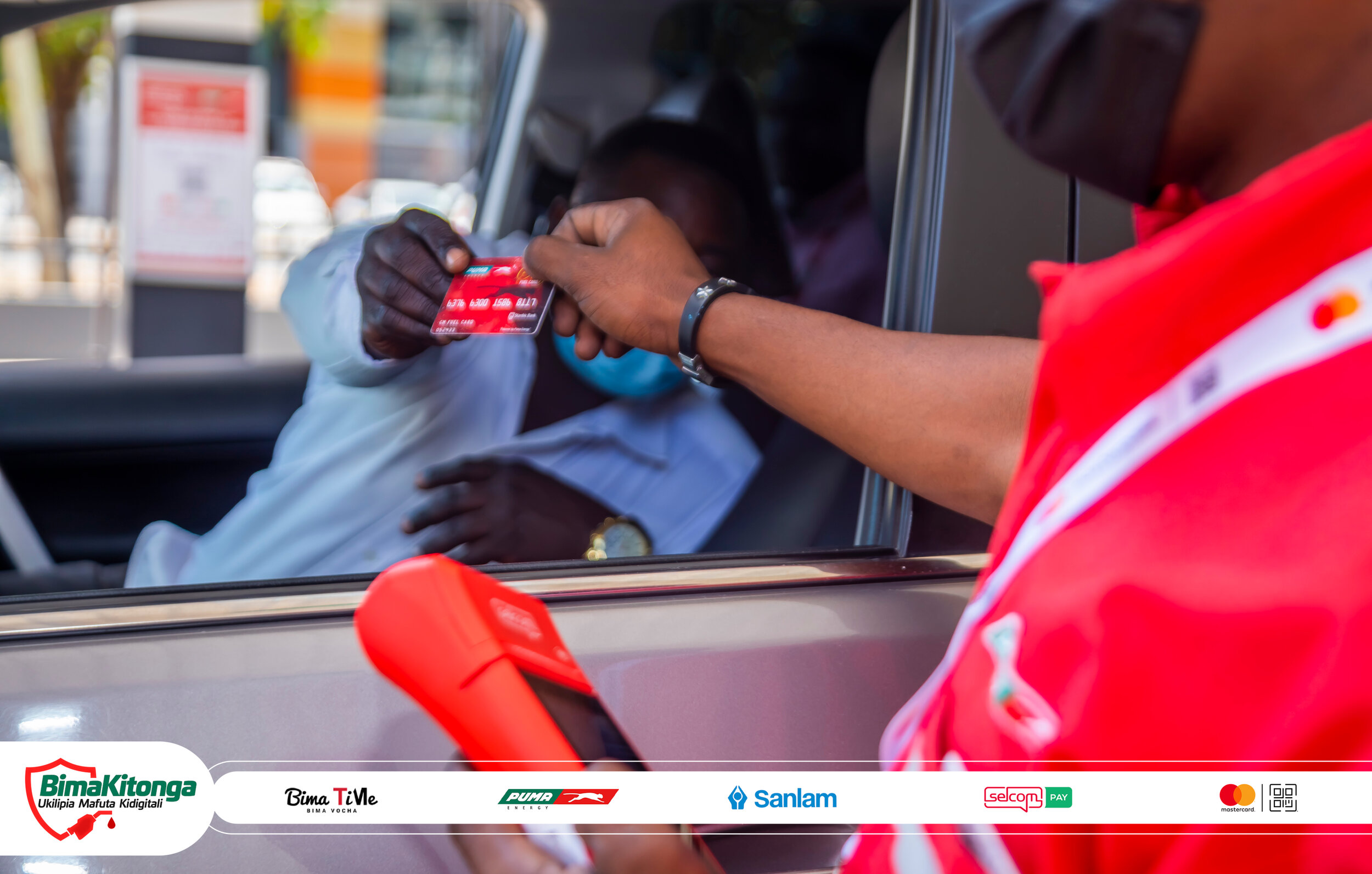 A car driver pays for fuel at the Puma Energy service station in Upanga using Puma Elite card to access 7-day life insurance cover by Sanlam.