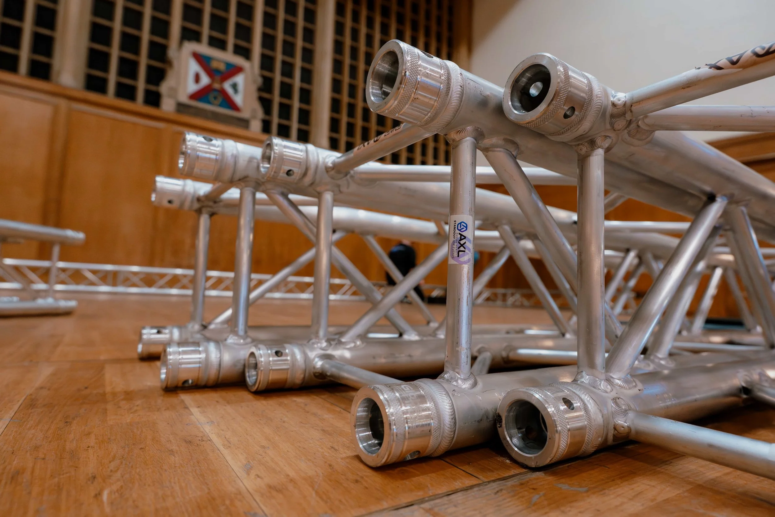 Square aluminium truss sections ready for a ground-support rigging build at an event venue