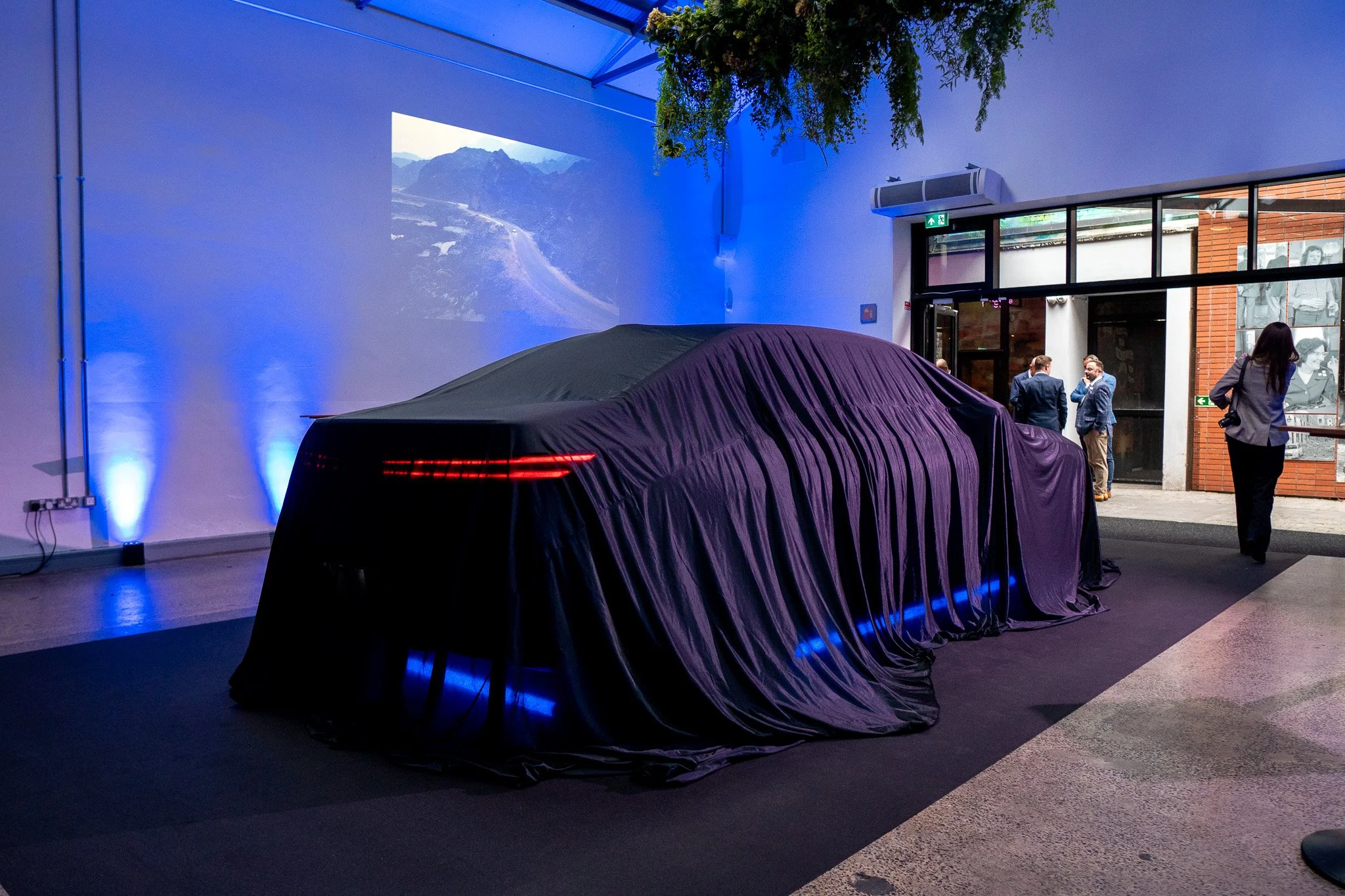 Waterman House Belfast washed in BMW brand blue by battery-powered LED uplighters for a car launch