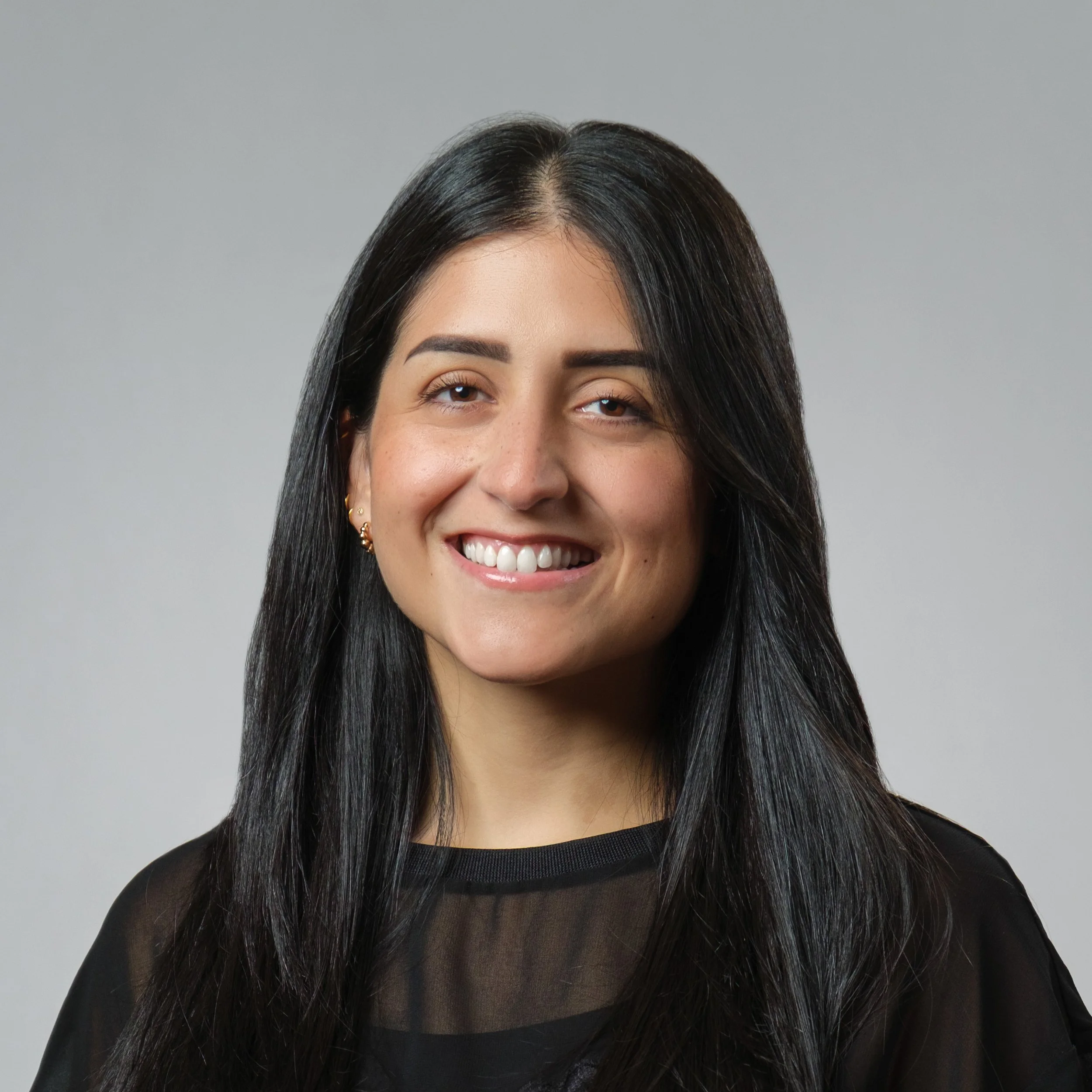 Female Corporate professional wearing a black top for her Headshot Session
