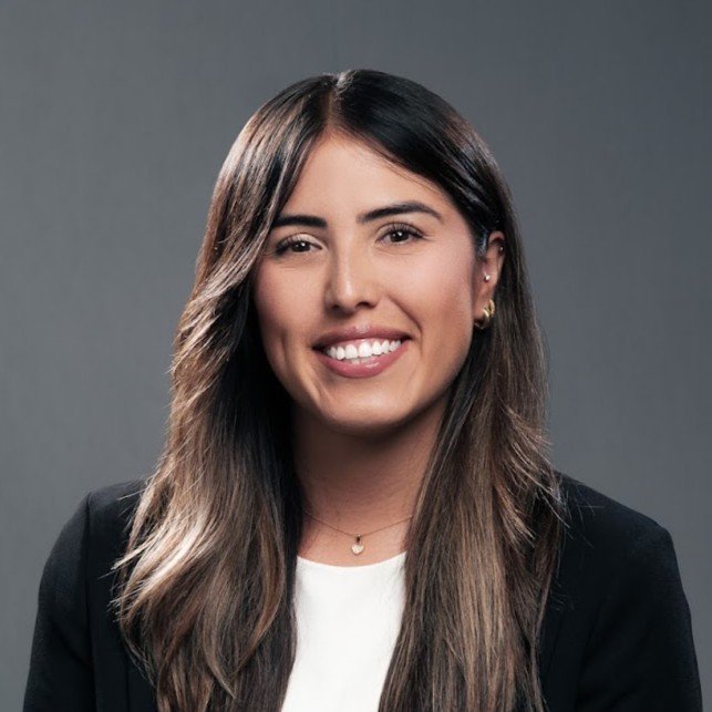 Female Law professional wearing a black suit jacket and white top for her Headshot Session