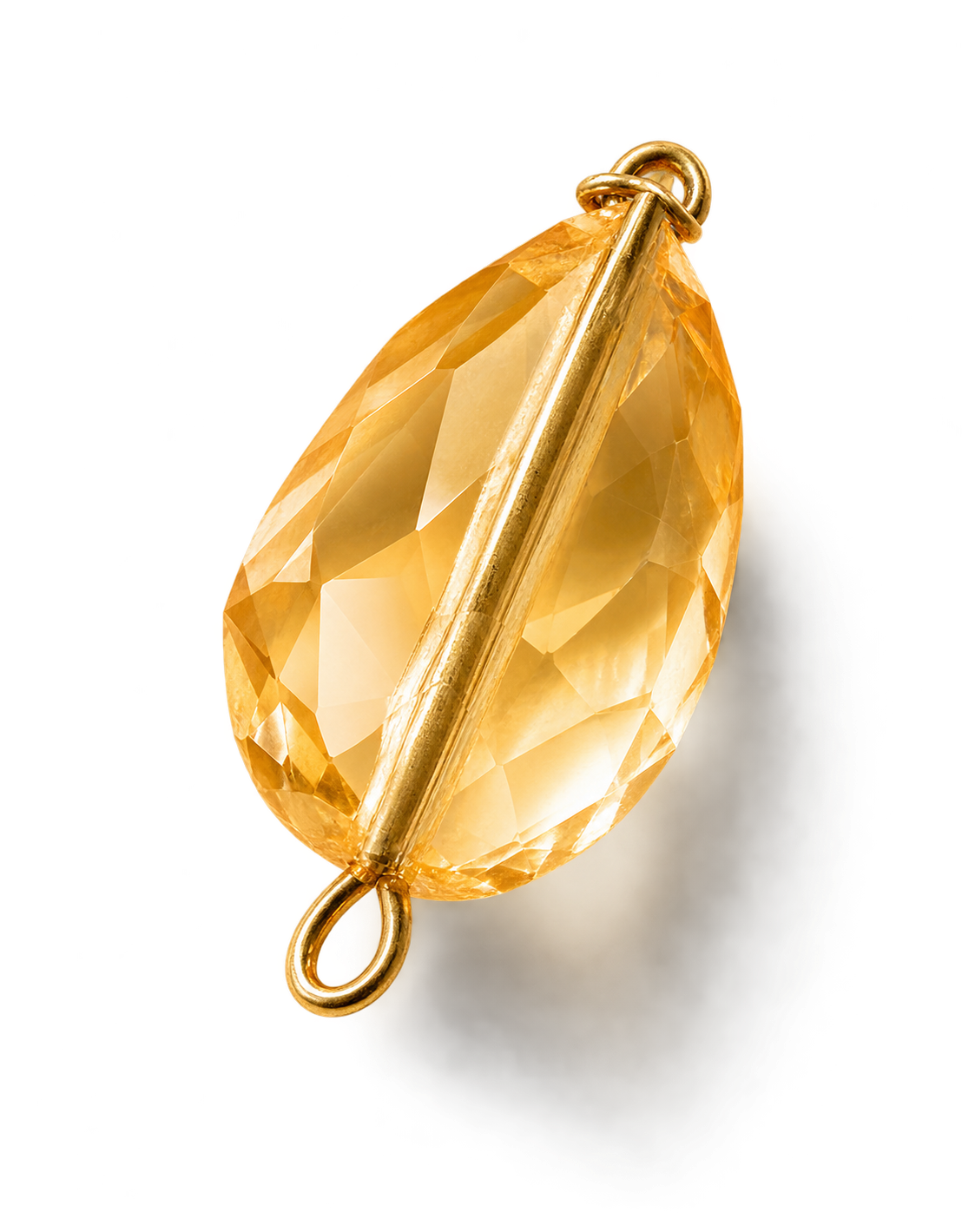 A gold pendant with a large faceted yellow gemstone and a gold loop for hanging.